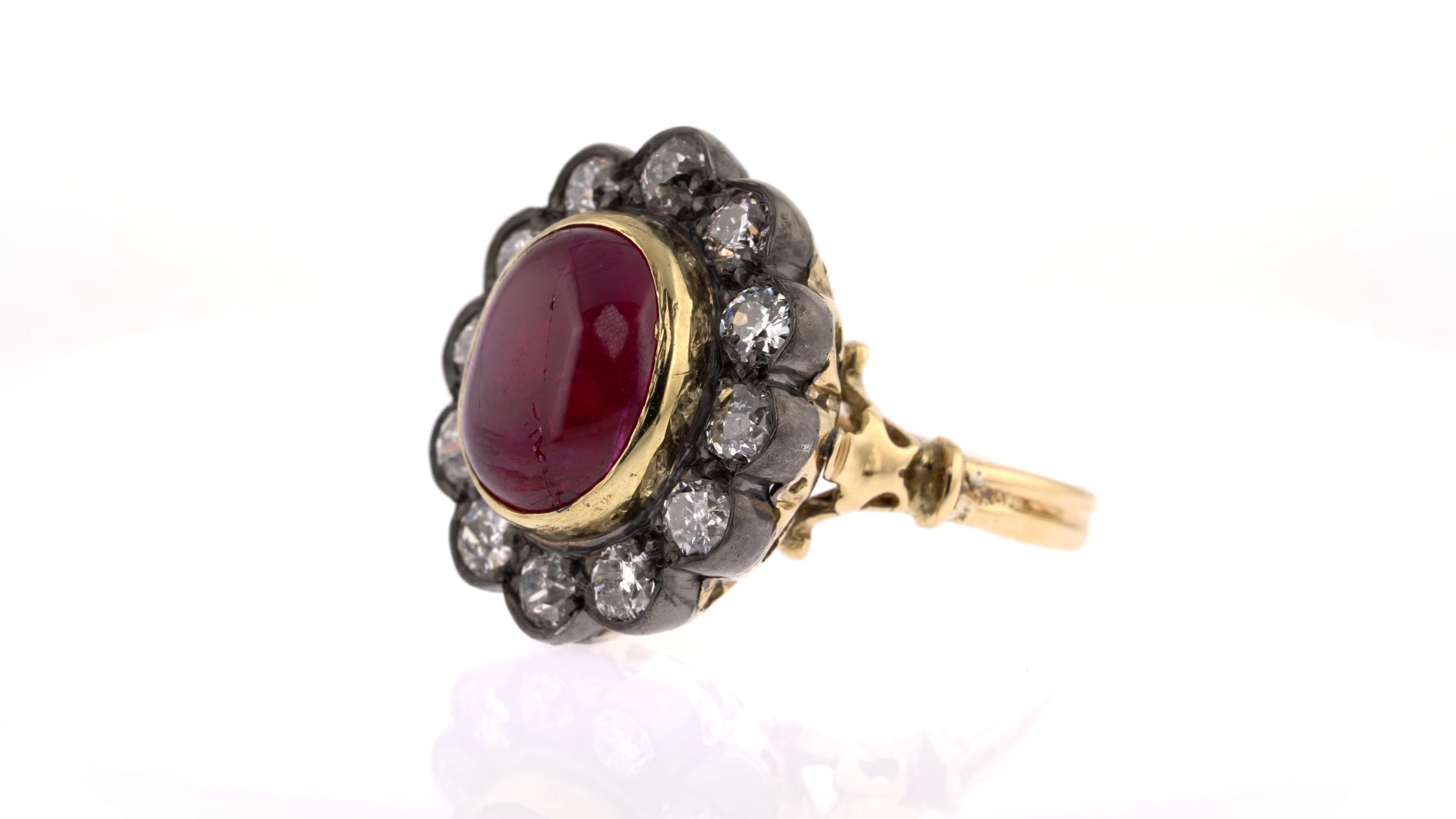 Women's 5.51 Carats Ruby Cabochon Ring with a Diamond Halo For Sale