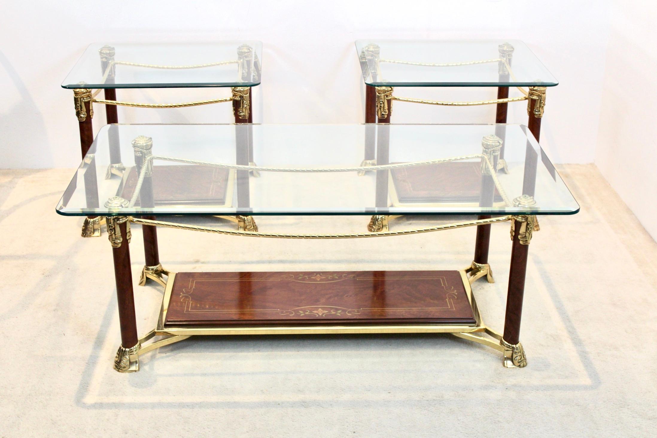 A truly beautiful set of brass and burr walnut coffee or side tables with solid glass tops. In true Hollywood Regency manner this elegant Hollywood Regency style pair have unique cut-out square and rectangular designs. Produced in France, circa