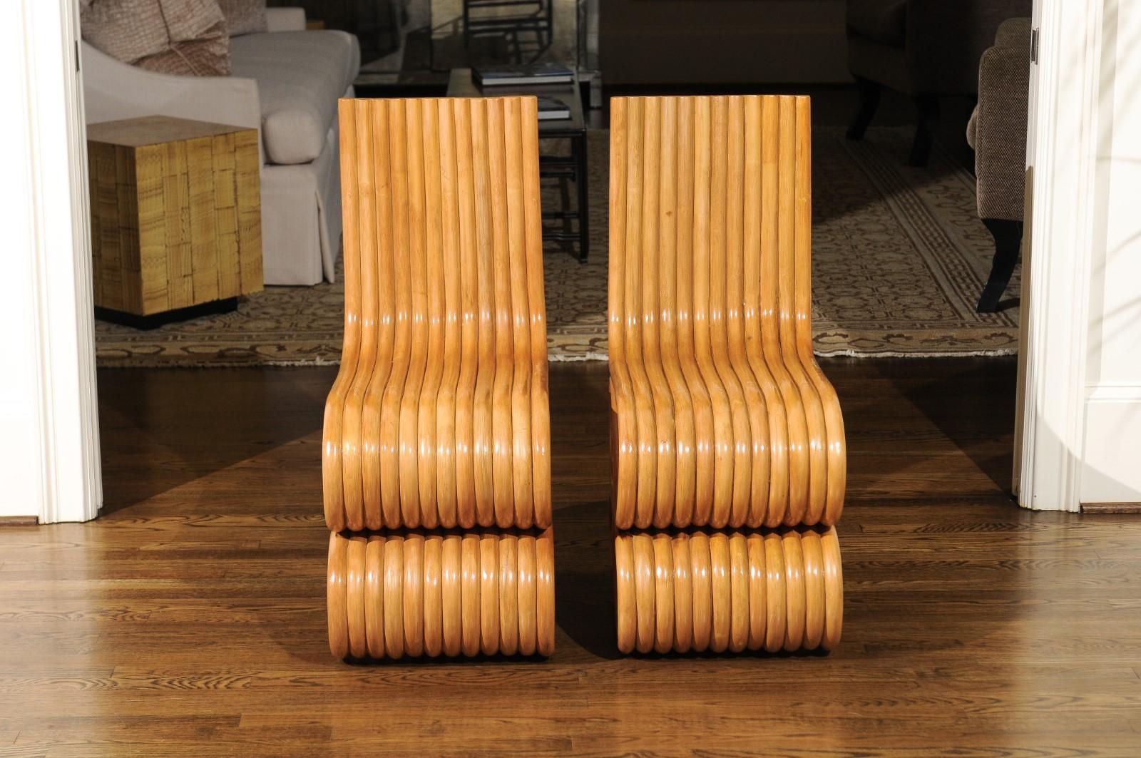 A unique set of ten (10) stunning custom made dining chairs, circa 1995. This particular rattan design was undoubtedly inspired by the groundbreaking Frank Gehry Wiggle chair series of the early 1970s. This fabulous set was custom commissioned for
