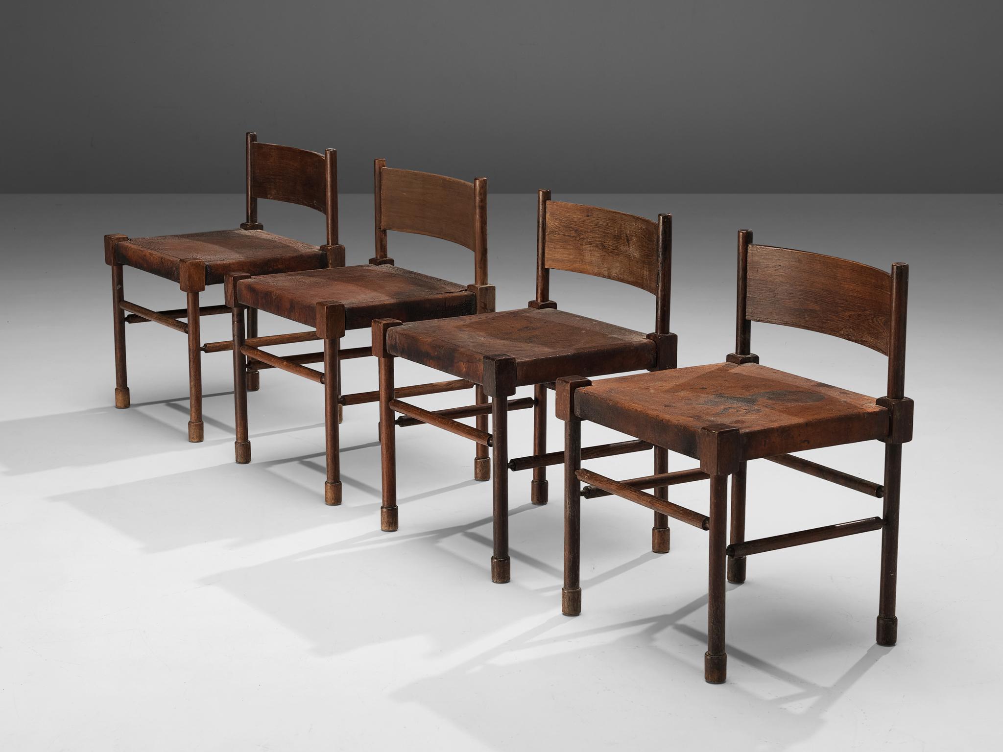 Set of four side chairs, stained wood, patinated leather, Brazil, 1940s

Rare side chair with sculpted frame in stained wood and leather seat. What makes this design so unique is the way the designer played with proportions and shapes. The detailed