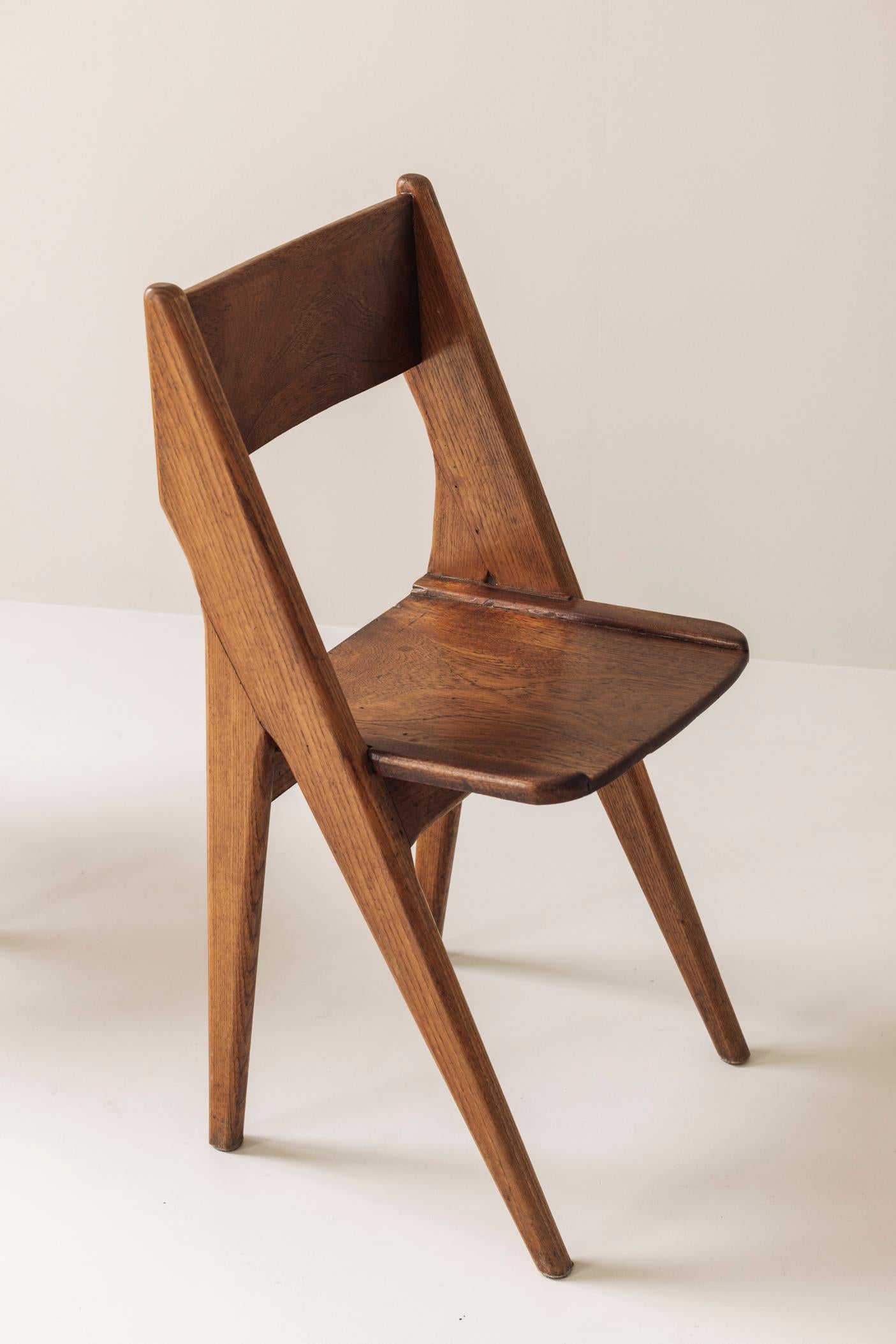 Exquisite set of four dining chairs in the manner of Jean Prouvé, France 1950s. 4