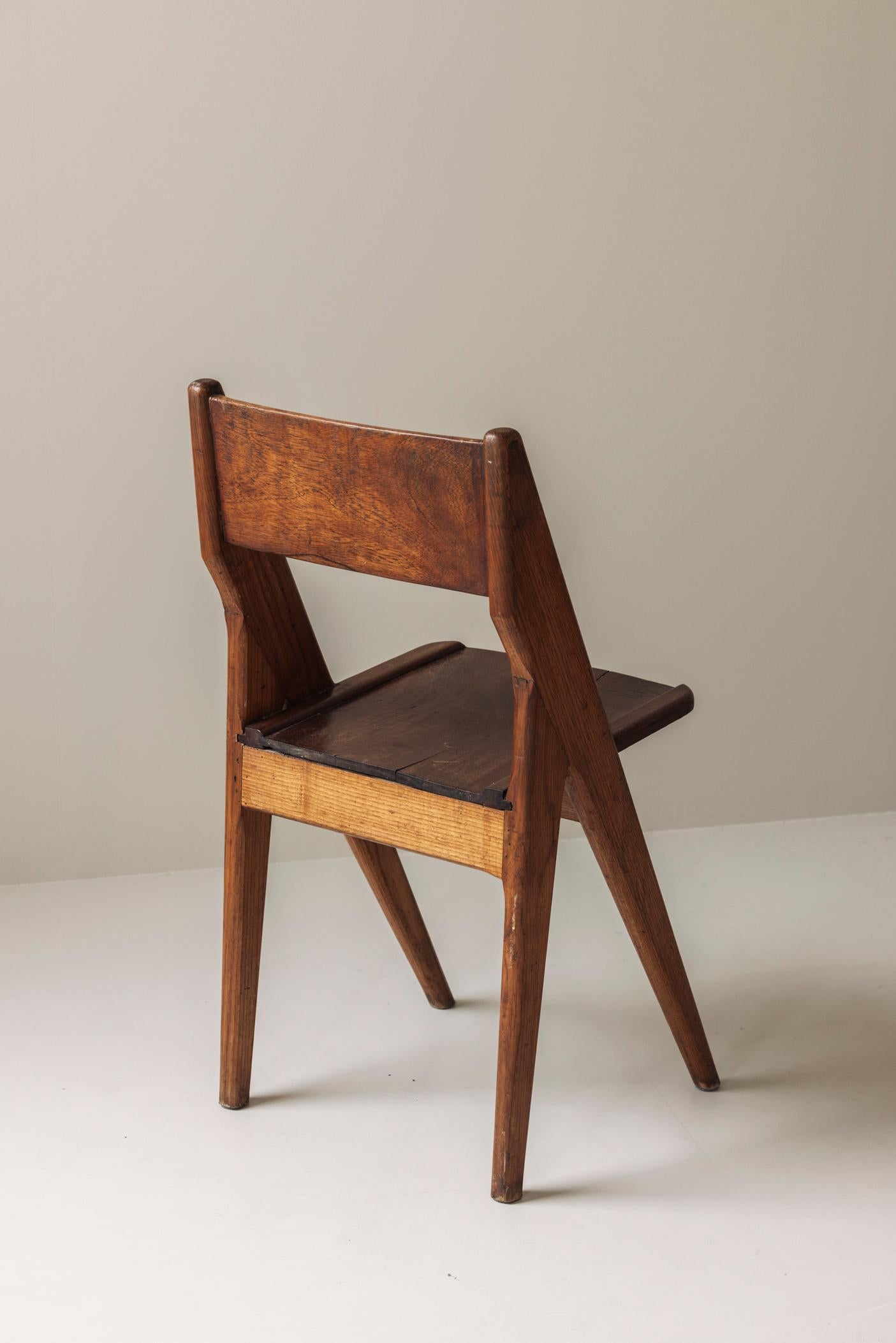 Wood Exquisite set of four dining chairs in the manner of Jean Prouvé, France 1950s.