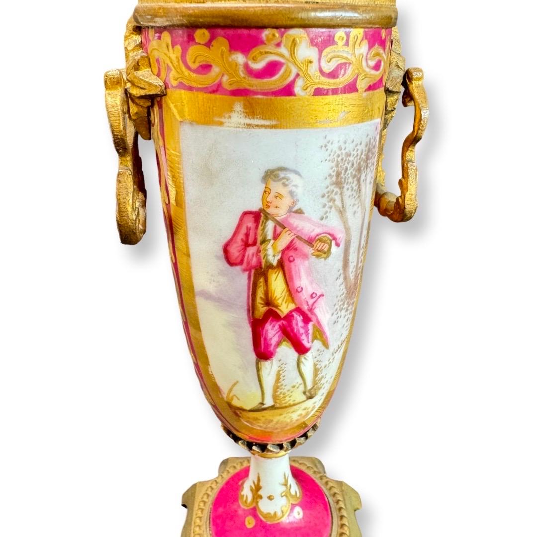 A porcelain vase crafted by the renowned Sèvres manufactory, one of the oldest and most prestigious porcelain workshops in France. Dating to the 19th century, the vase features hand-painted decoration: a depiction of a young musician on one side and