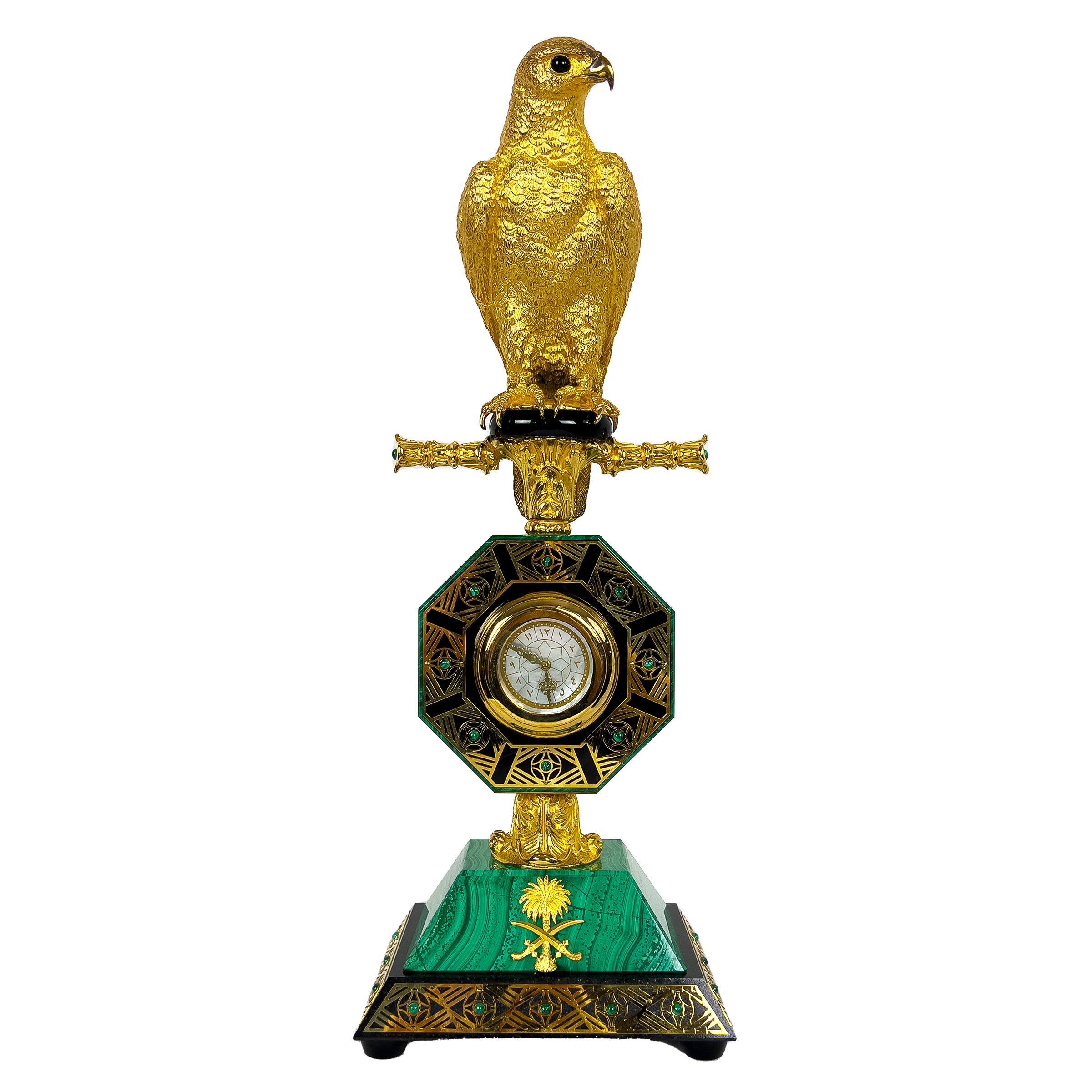 A clock falcon statue made of silver and malachite, presented as a gift to the Saudi Arabian royalty. Delve into the world of opulence and elegance with this stunning Silver Malachite Clock. Crafted with meticulous attention to detail, this
