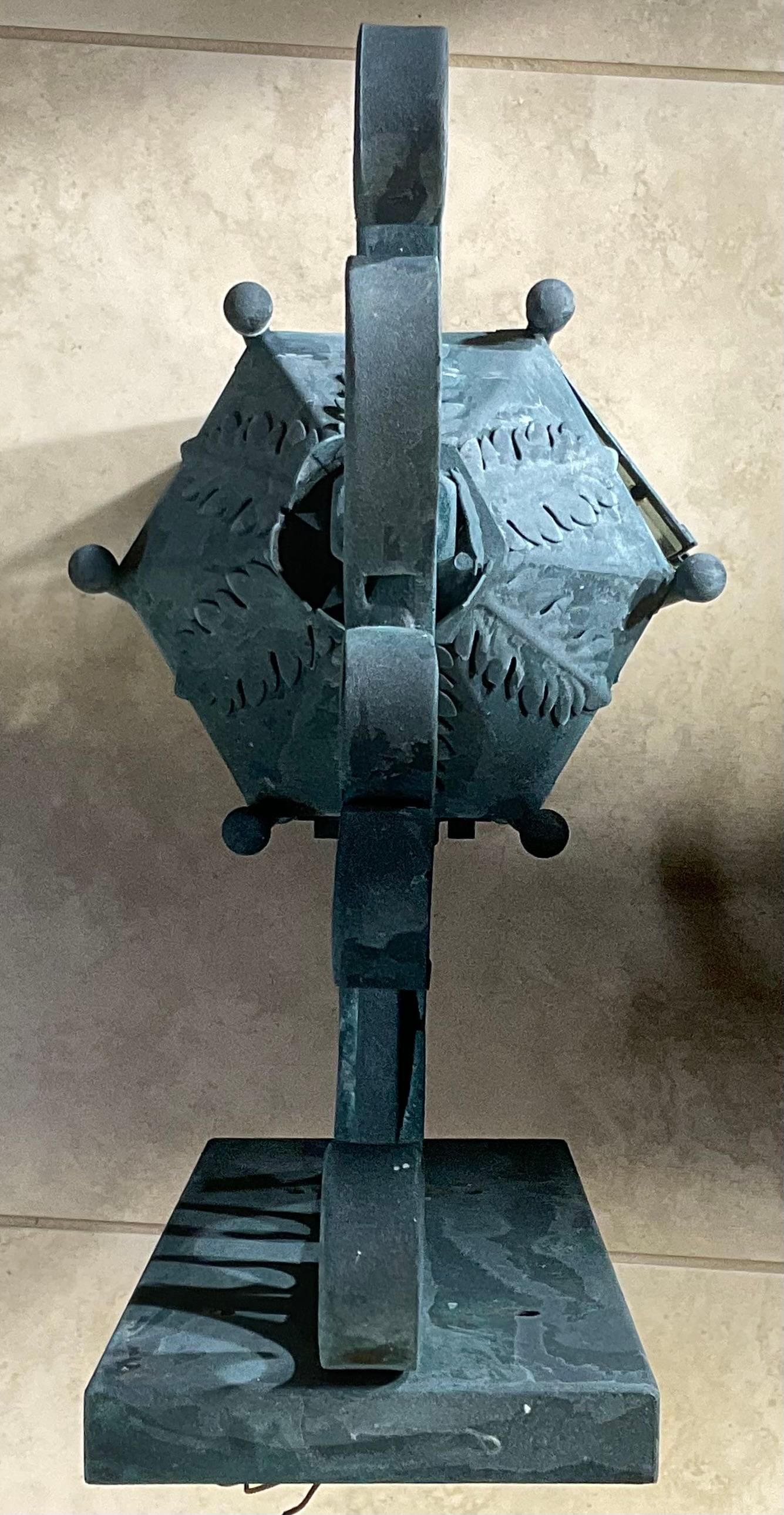 

Add a touch of timeless elegance and charm to your home with this solid iron wall lantern. Perfect for enhancing outdoor facades, entryways, patios, or even interior spaces seeking a unique architectural element, this lantern combines robust