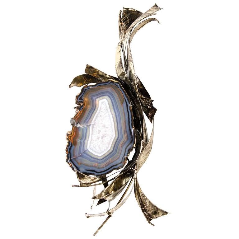This Exquisite Sliced Cerulean Blue Crystal Geode Wall Sculpture by Marc D'Haenens originates from Belgium, Circa 1970. Features a one of a kind sliced geode detailing surrounded in stunningly treated sculptural patinated bronze applied and styled