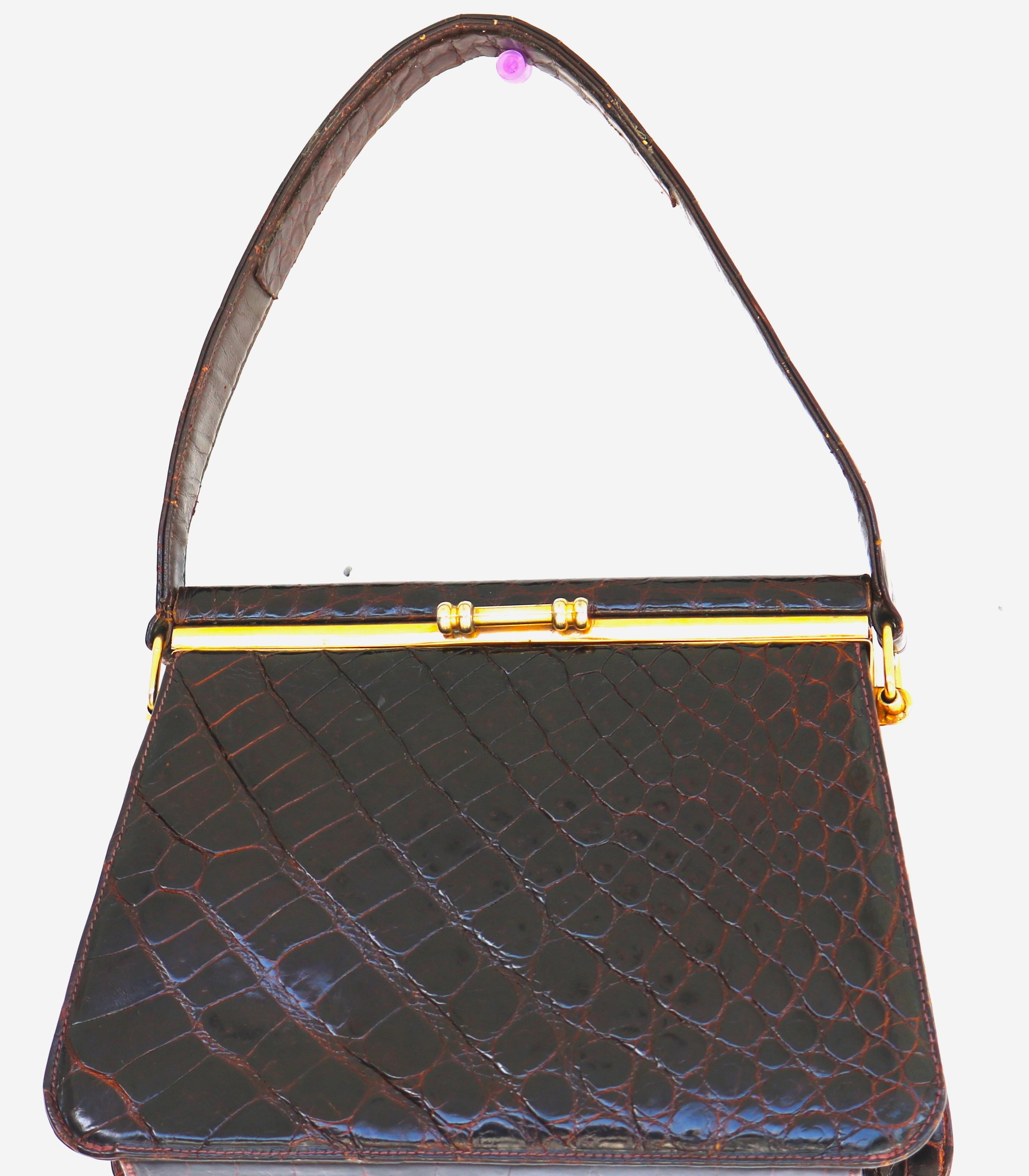 Gorgeous Brown Crocodile Evening Handbag.. Chic and Small Handbag with a Reinforced Strong Croc. Handle-Prepared to Last a Long Time.
Fabricated by the finest designer handbag maker with the finest details, 
without label.
A gold plate frame
