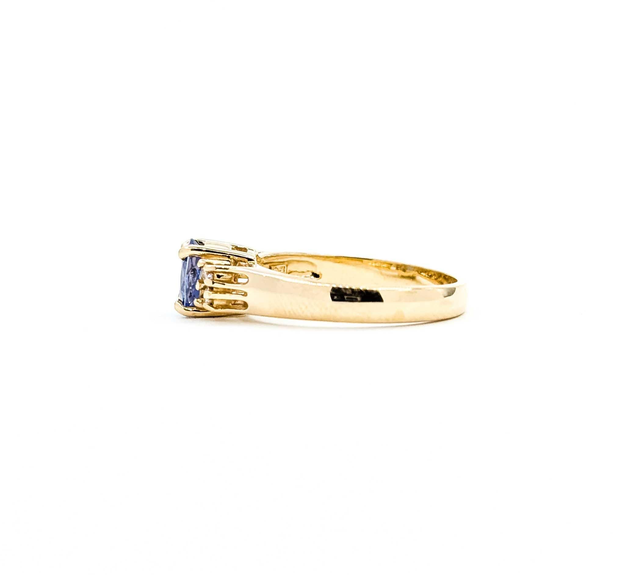 Exquisite Tanzanite and Diamond Ring in 14k Yellow Gold For Sale 3