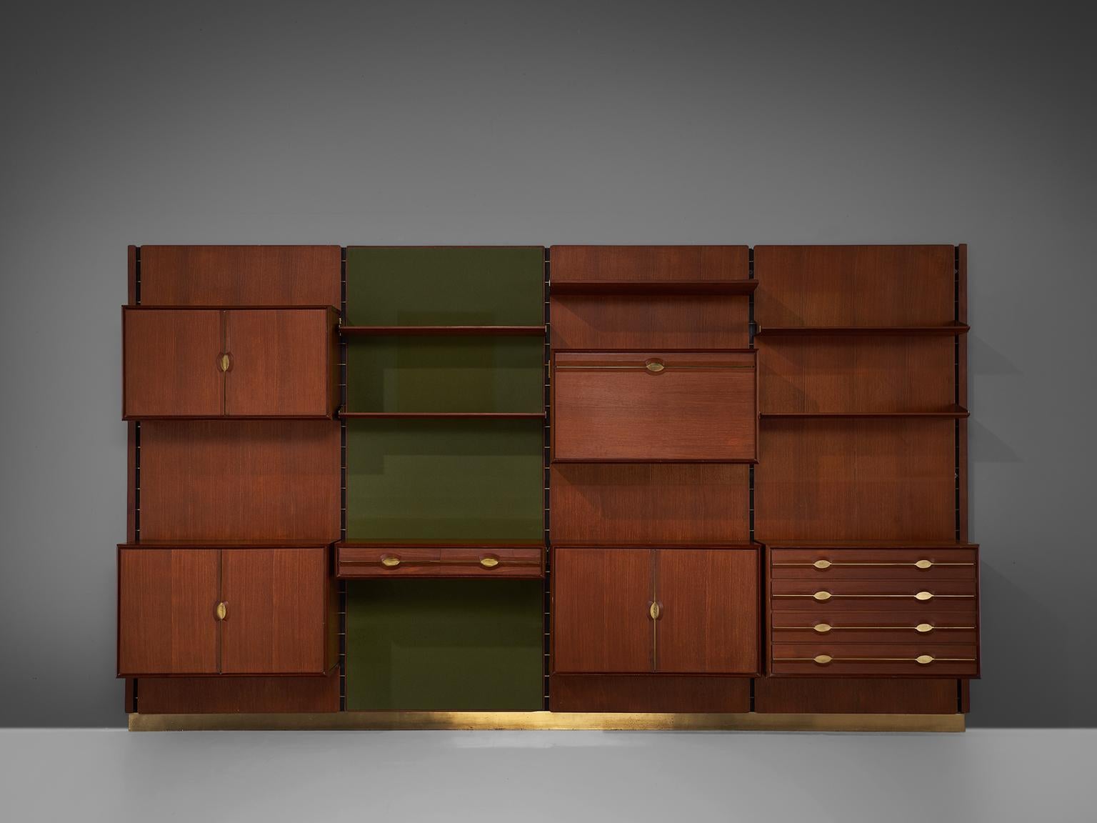 Cabinet by La Permanente Mobili Cantu, brass, teak, Italy, circa, 1955.

The monumental wall-mounted cabinet consists of four wall panels with various different storage facilities. The finish and details of this shelving wall unit are of a very