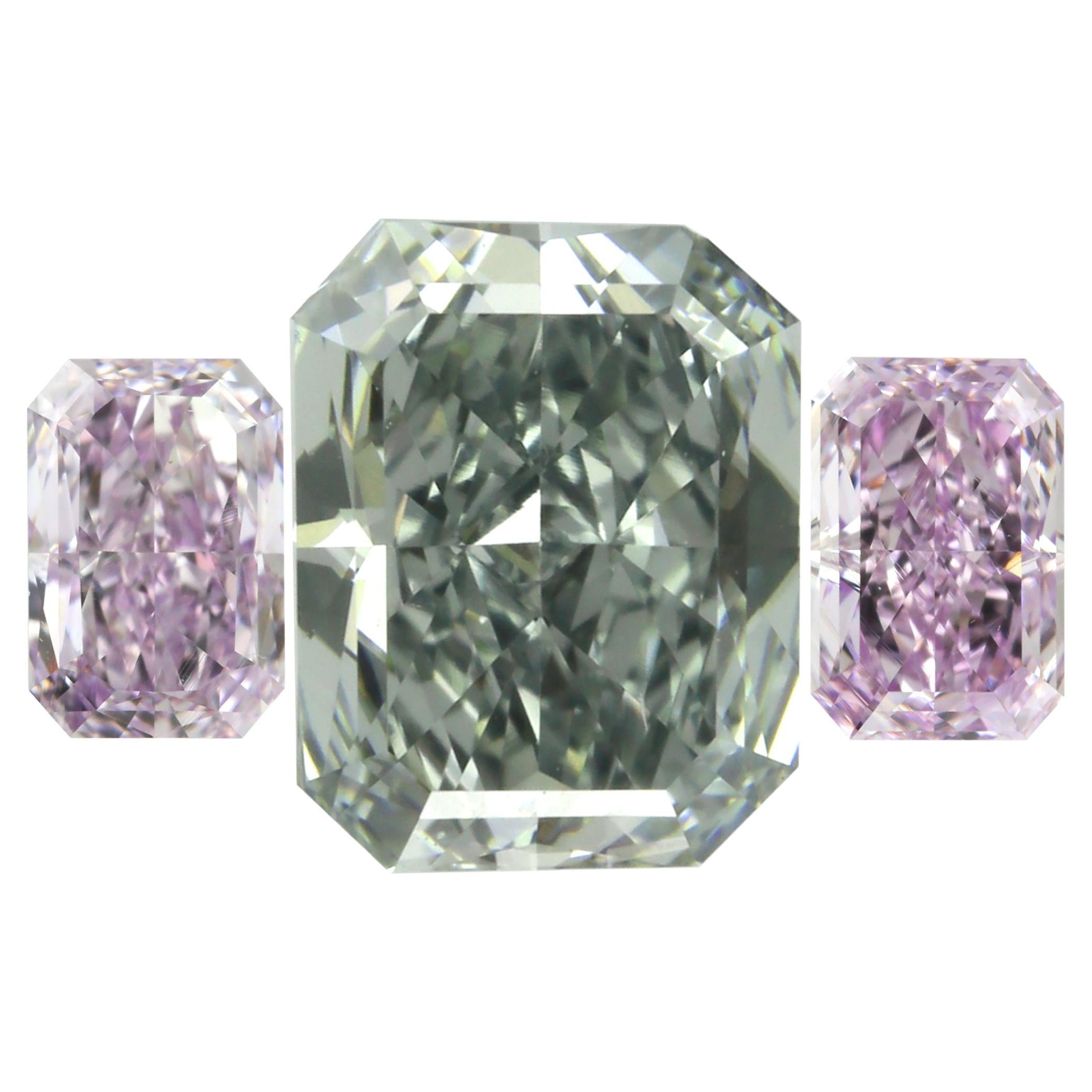 Exquisite Three-Stone Set Featuring Fancy Blue-Gray 
Pinkish Purple Diamonds • For Sale