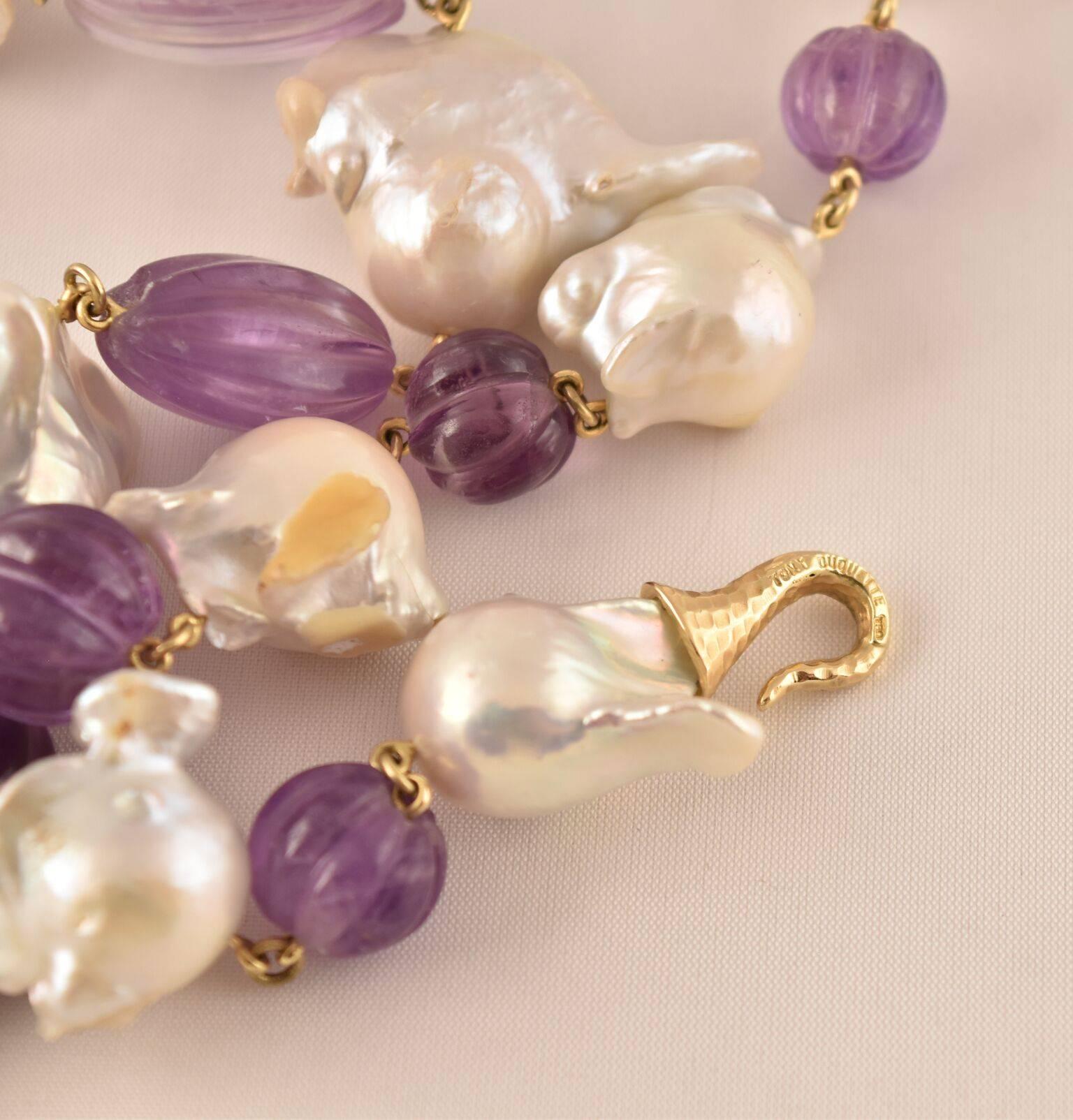 Beautiful Fluted Amethyst and Baroque Pearl Statement Necklace held by an 18k yellow gold clasp, by Tony Duquette, Designer Extraordinaire! Fluted Amethyst (app. 290ct.); approx. 24” long x .75-1” wide; Outstanding Piece of Timeless Beauty! 
