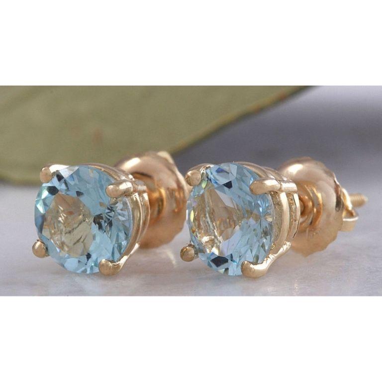 Exquisite Top Quality 2.00 Carats Natural Aquamarine 14K Solid Yellow Gold Stud Earrings

Amazing looking piece!

Total Natural Round Cut Blue Aquamarine Weight: Approx. 2.00 Carats (both earrings)

Aquamarine Treatment: Heating

Aquamarine