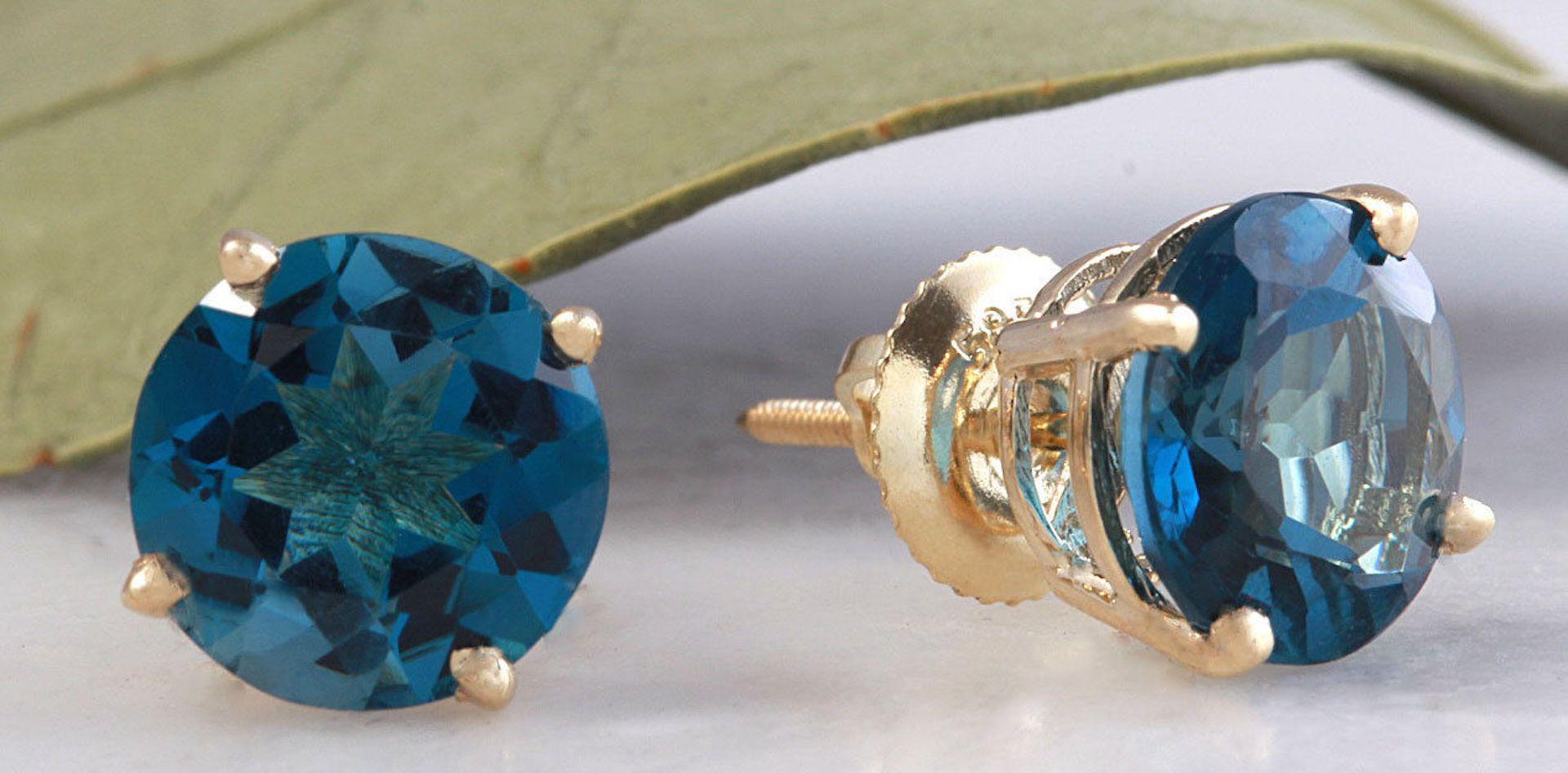 Exquisite Top Quality 4.25 Carats Natural London Blue Topaz 14K Solid Yellow Gold Stud Earrings

Amazing looking piece!

Total Natural Round Cut London Blue Topaz Weight: Approx. 4.25 Carats (both earrings)

London Blue Topaz Measures: 8mm

Topaz