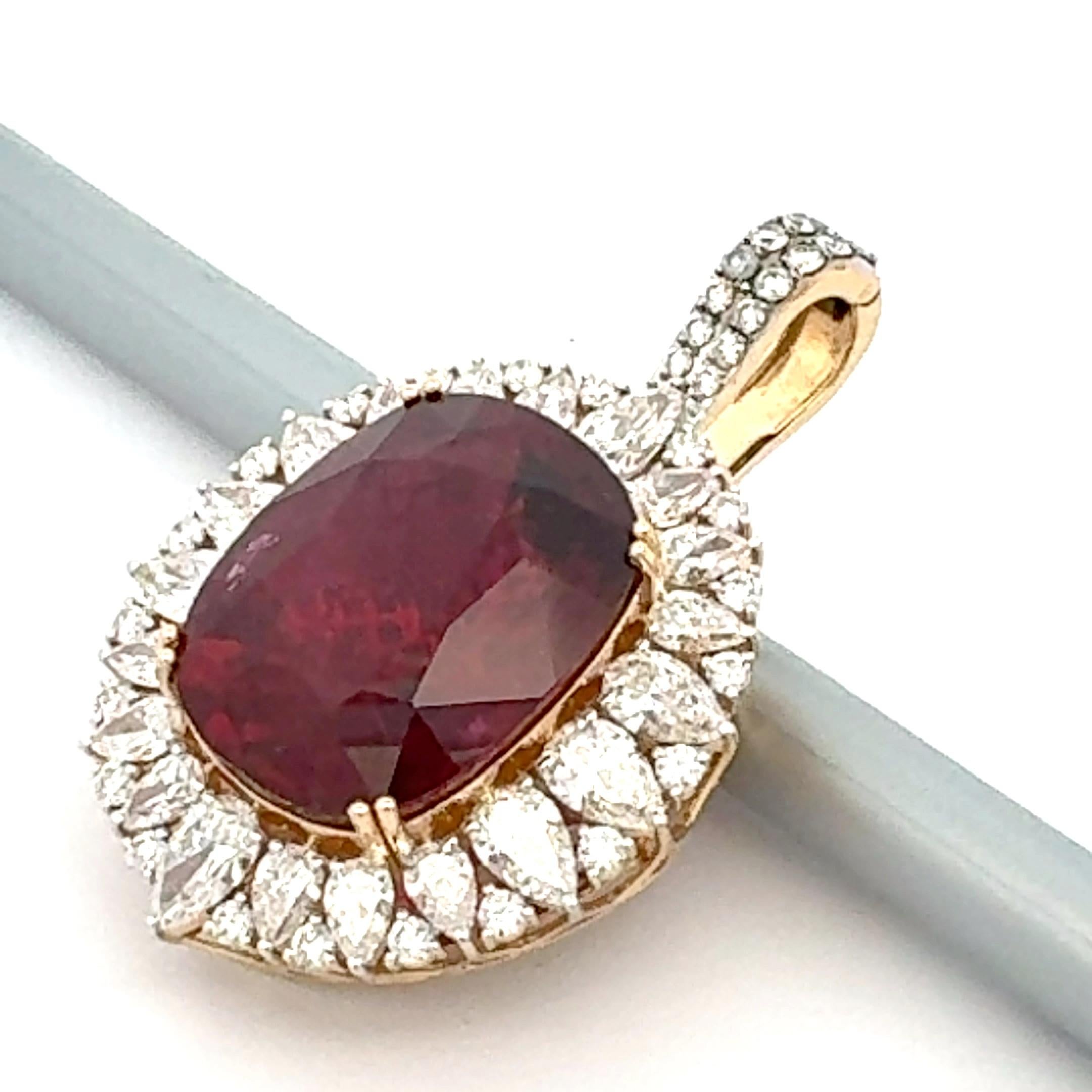 Detachable pendant features a stunning center tourmaline 'rubellite', meticulously surrounded by sparkling diamonds set in 18k yellow gold. The rich red hue of the rubellite contrasts beautifully with the brilliance of the diamonds, creating a