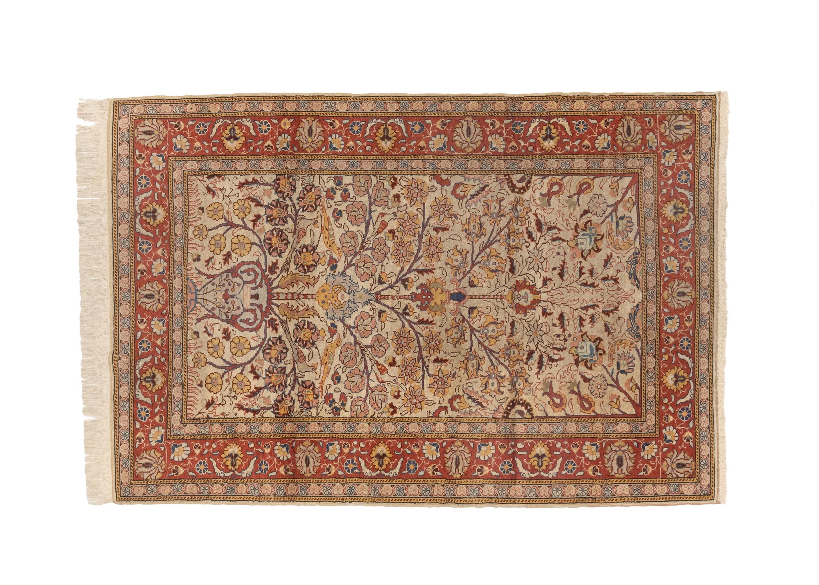 This vintage Turkish handmade silk rug from the 1920s is a true masterpiece of craftsmanship and artistry. It is a luxurious and meticulously woven piece that reflects the rich cultural heritage of Turkey and the skillful techniques passed down