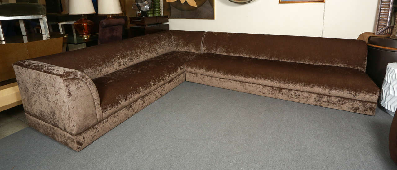 Exquisite two-piece sectional sofa by Steve Chase. It may be arranged in two different configurations. It has been reupholstered in a beautiful mink colored velvet chenille.