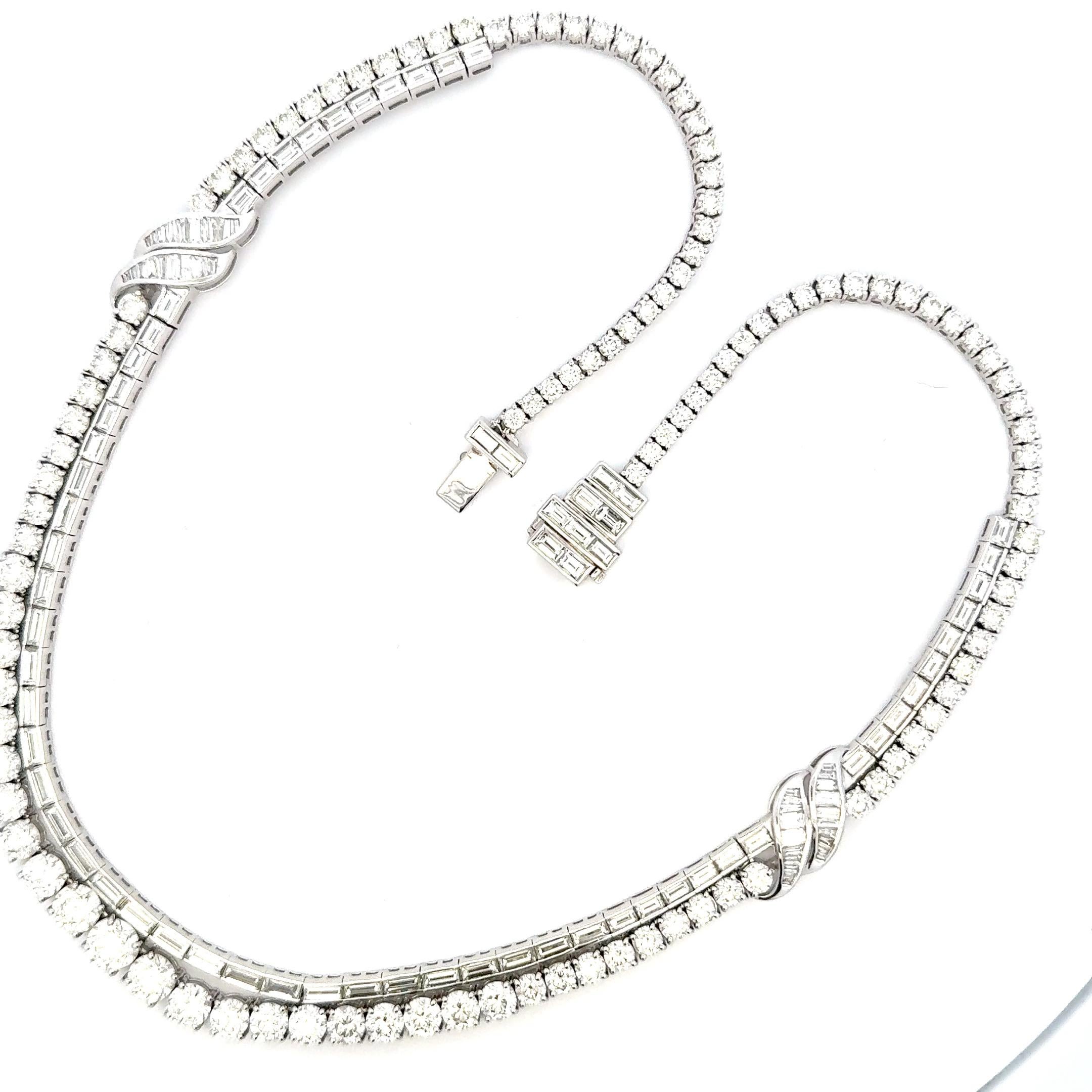La raffinata collana di diamanti di lusso a due file presenta due eleganti file di 32,28 carati di diamanti di qualità E/F vs meticolosamente incastonati, che creano uno splendido effetto a strati che aggiunge profondità e raffinatezza al design. I
