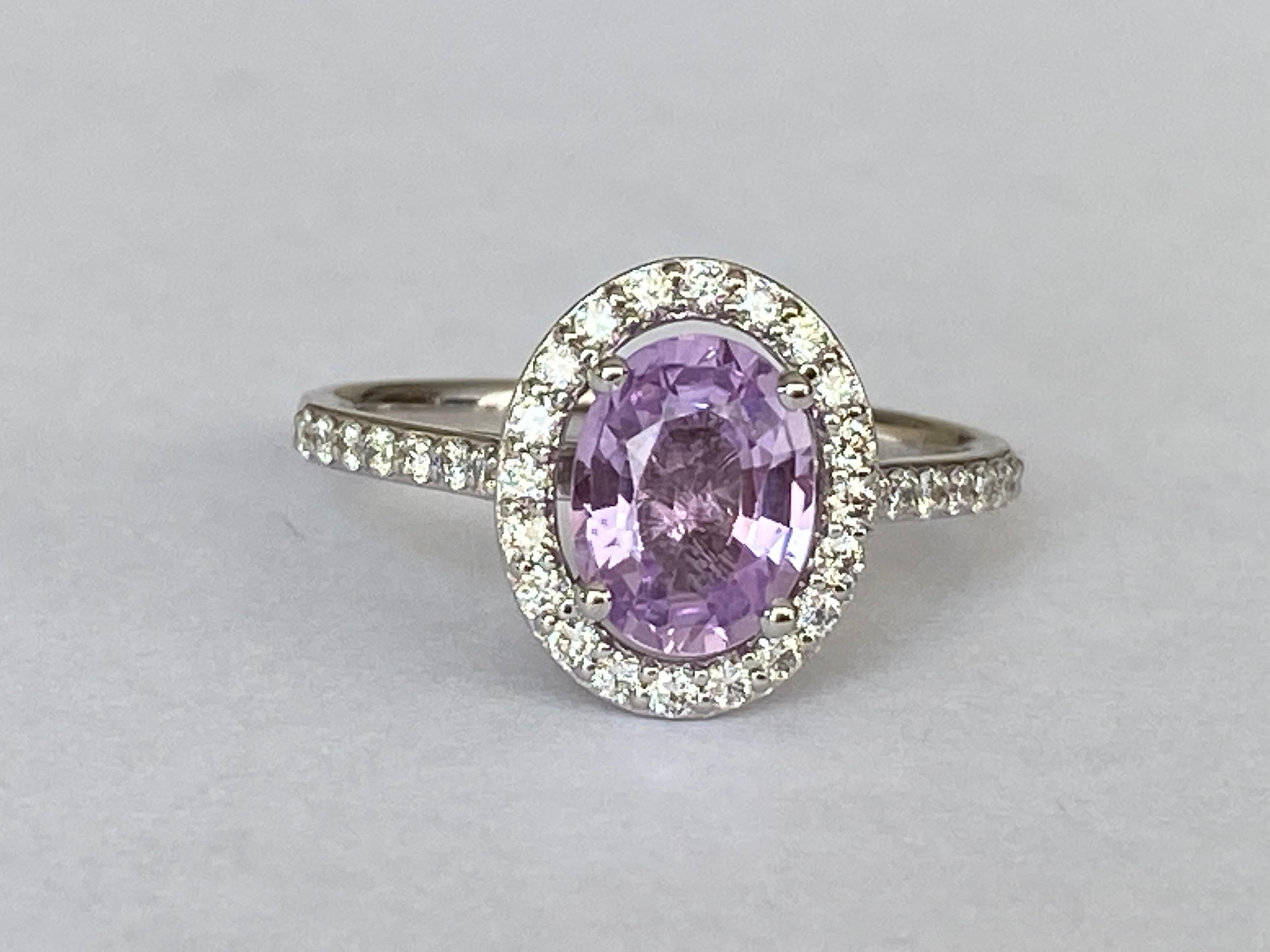 Exquisite and rare piece of jewelry! The combination of an untreated purple-pink sapphire, surrounded by brilliant cut diamonds, set in white gold creates an elegant and timeless design. It’s fascinating how the natural, unheated nature of the