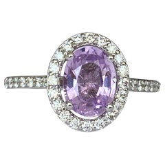 Exquisite Unheated Pink-Purple Sapphire Halo Ring in 18 kt white gold