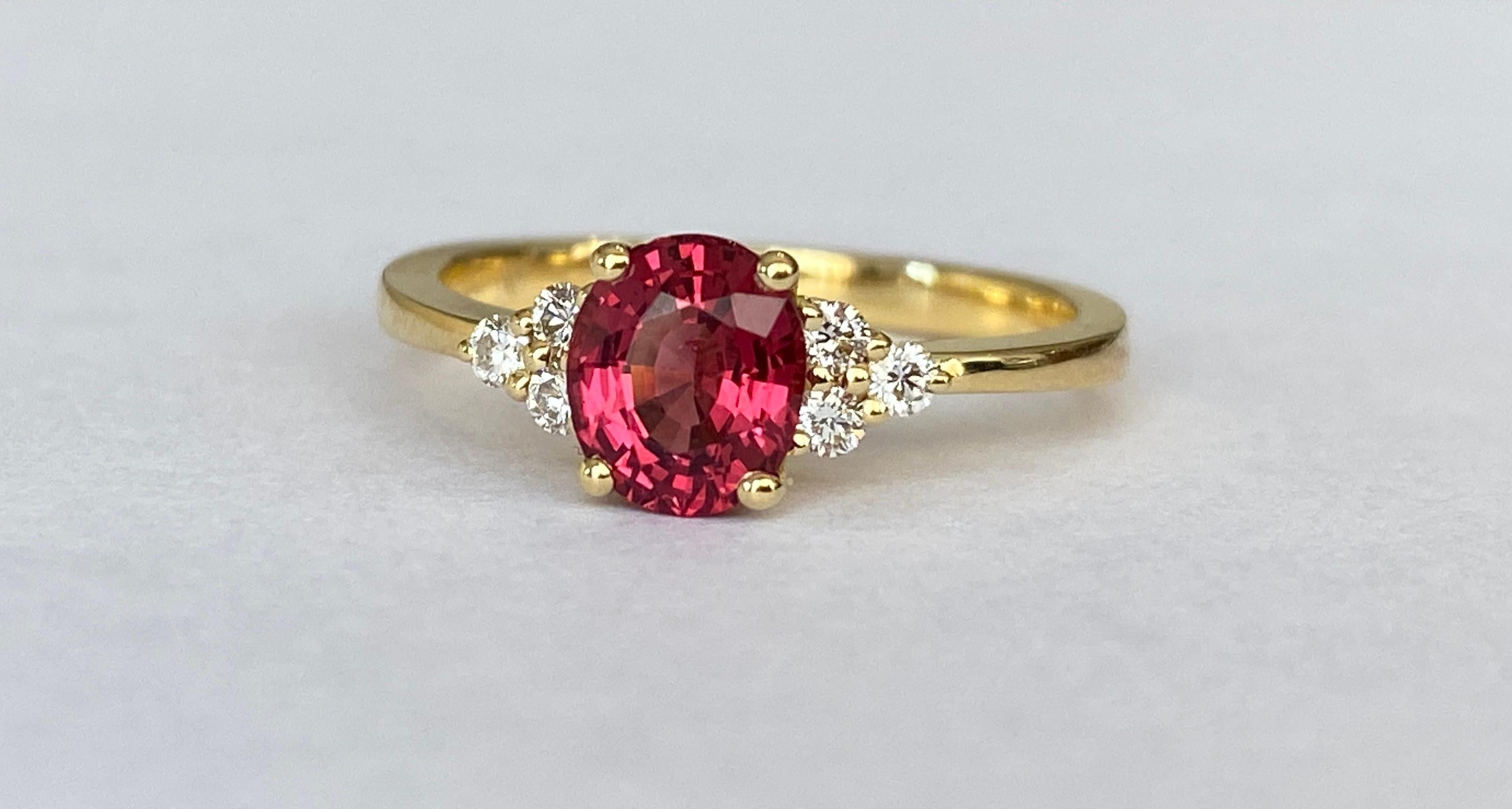 Exquisite Unheated Pinkish-Red Burma Spinel and Diamond Engagement Gold Ring. The combination of unheated, untreated  Burma pinkish-red spinel alongside high-quality F/VS diamonds creates a rare and timeless design. The 18 kt yellow gold setting