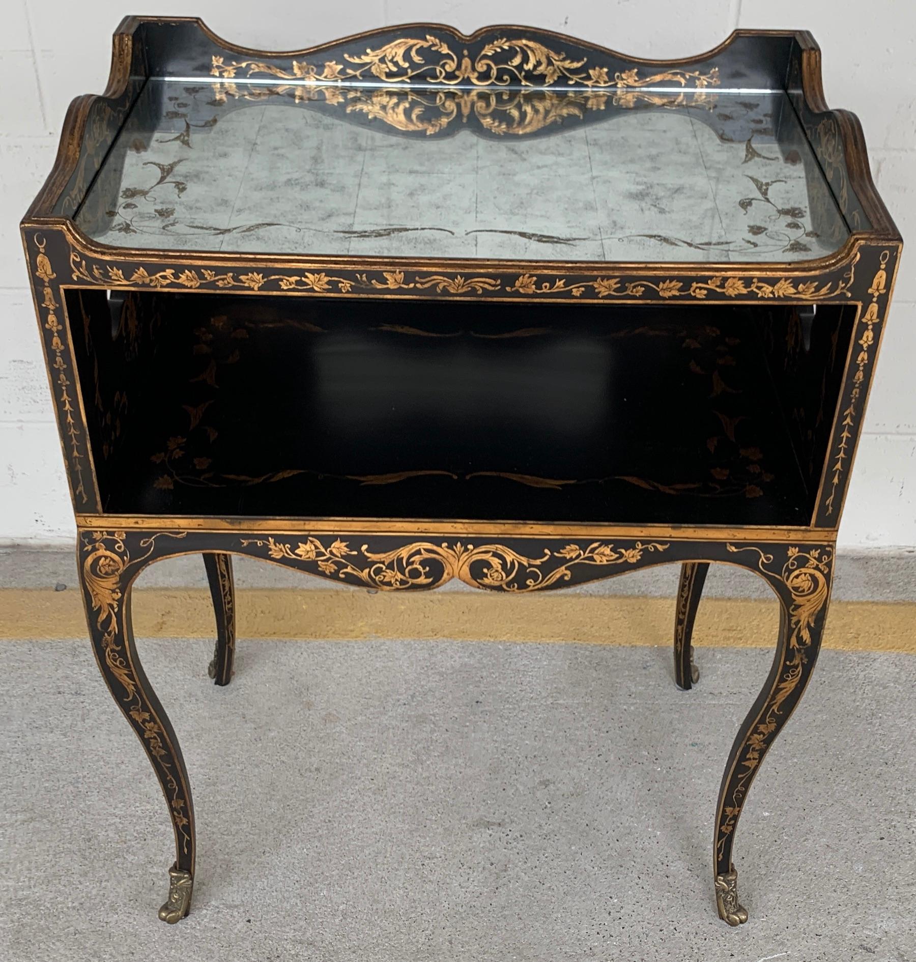 Exquisite Venetian style églomisé gilt lacquered tiered end table/ nightstand, of rectangular form with gallery top with gilt and enameled églomisé/mirrored top (24