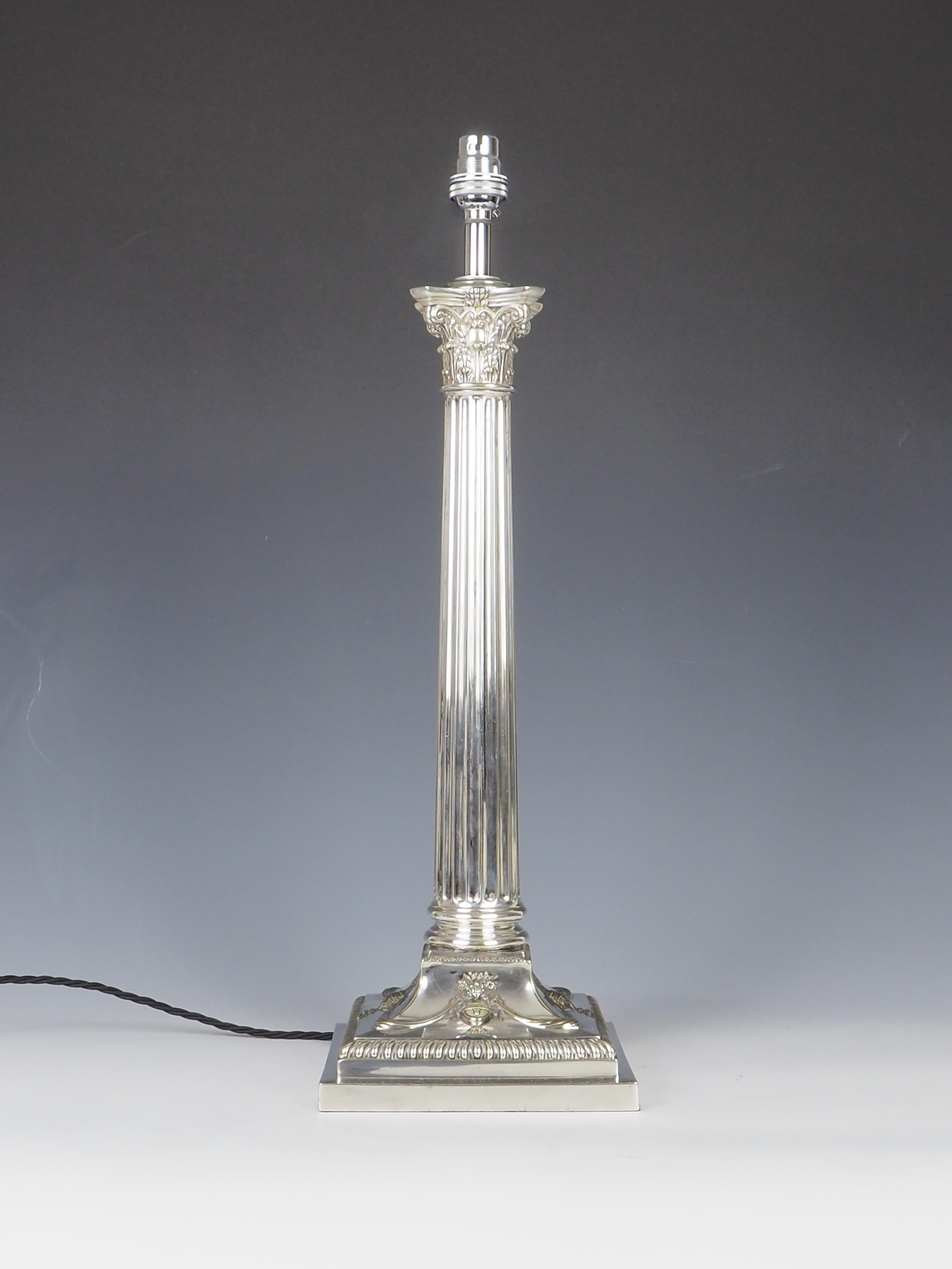 Exquisite Victorian silver-plated Corinthian column table lamp, dating back to around 1870, has been meticulously converted to electricity while retaining its elegant and timeless design.

The lamp showcases a stunning Corinthian Capital and a base