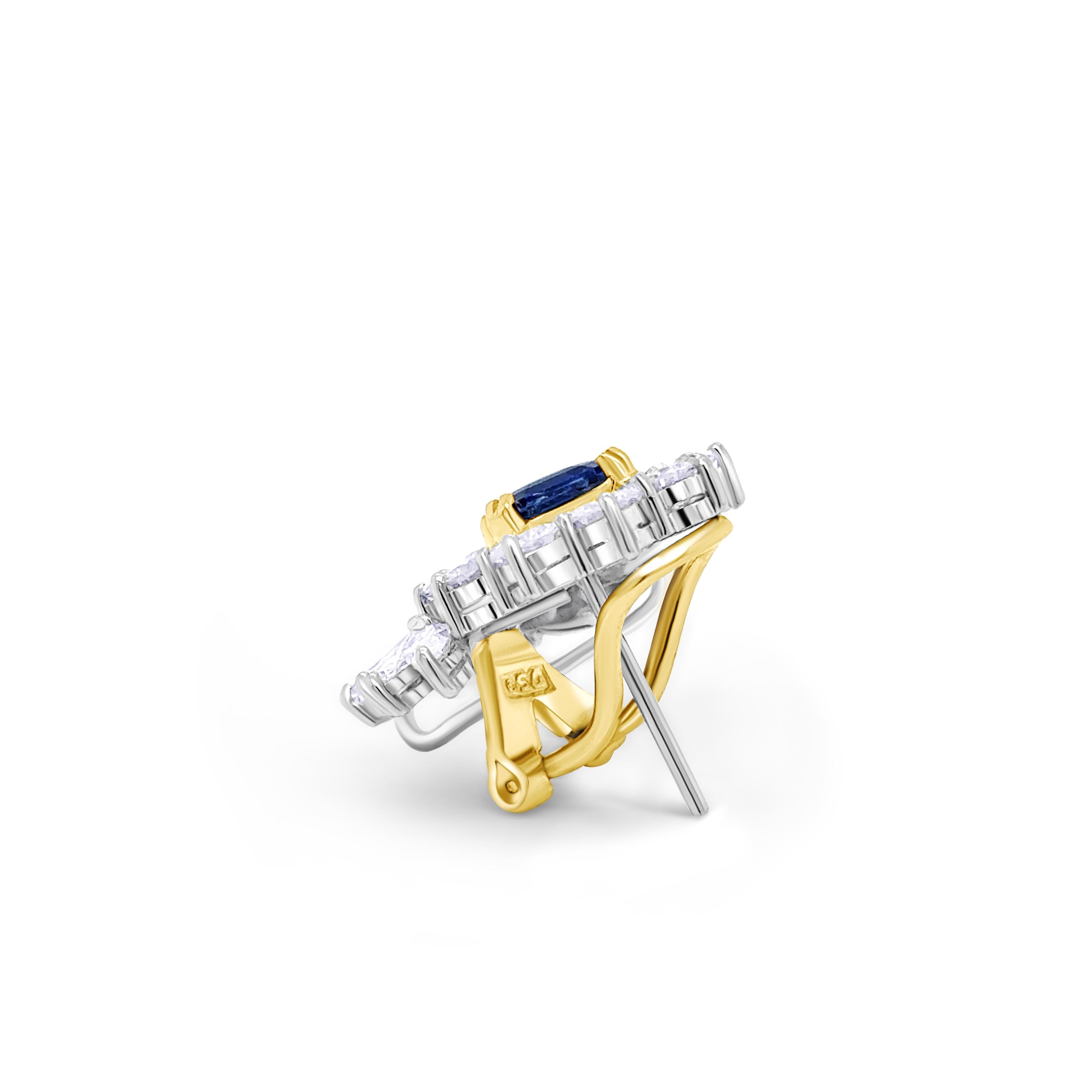 Elevate your jewelry collection with these breathtaking vintage sapphire and diamond earrings, crafted with timeless elegance and exceptional craftsmanship. Each earring features a mesmerizing deep-blue sapphire at its center, encircled by a