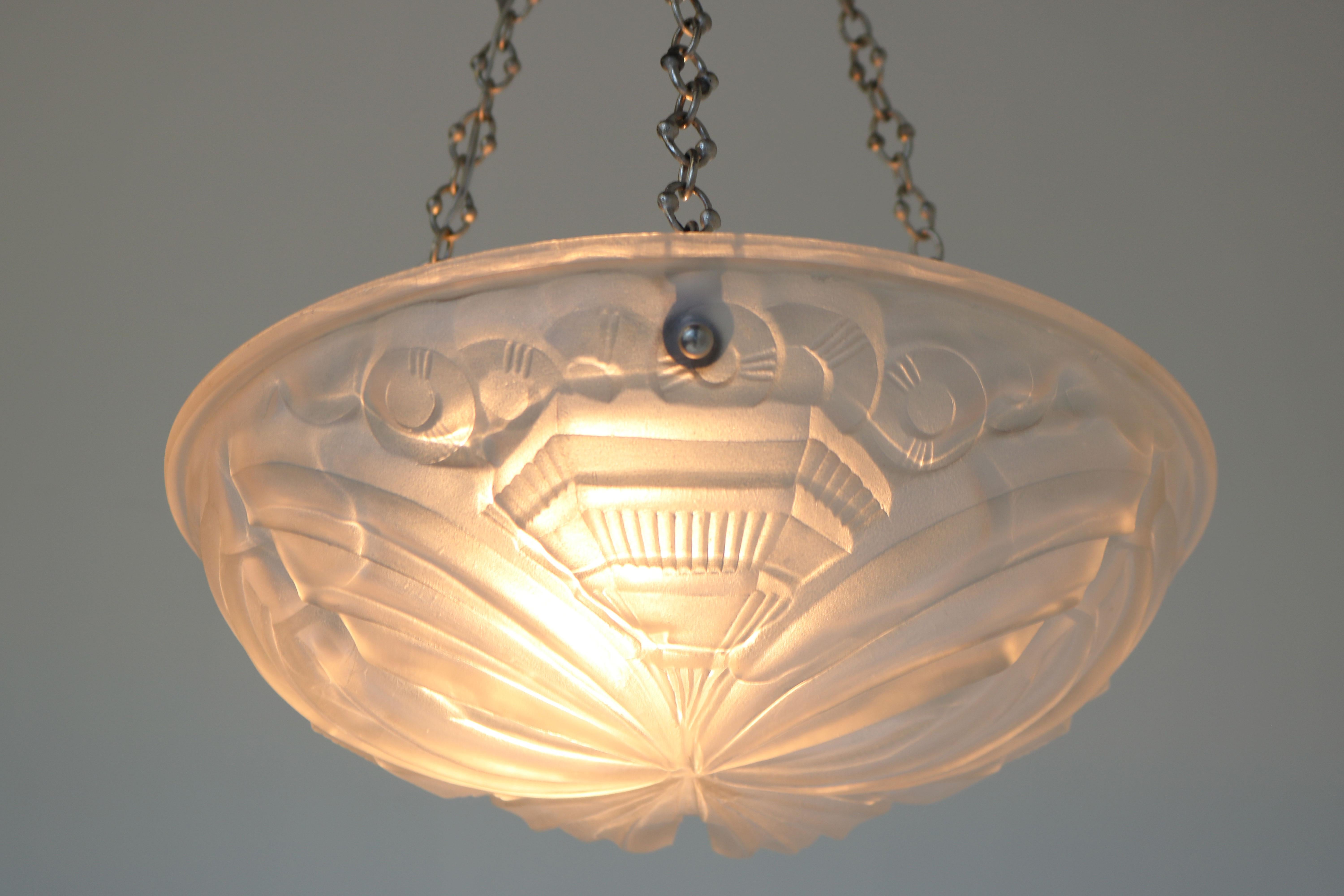 Exquisite & Timeless! This stunning Geometric Art Deco light attributed to Henry Mouynet from France 1930. 
The quality of the glass & design are of amazing quality , when lit this chandelier is just breathtaking. 
It comes with a gorgeous