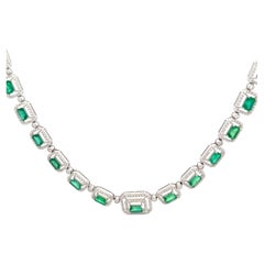 Exquisite white gold emerald and diamond necklace