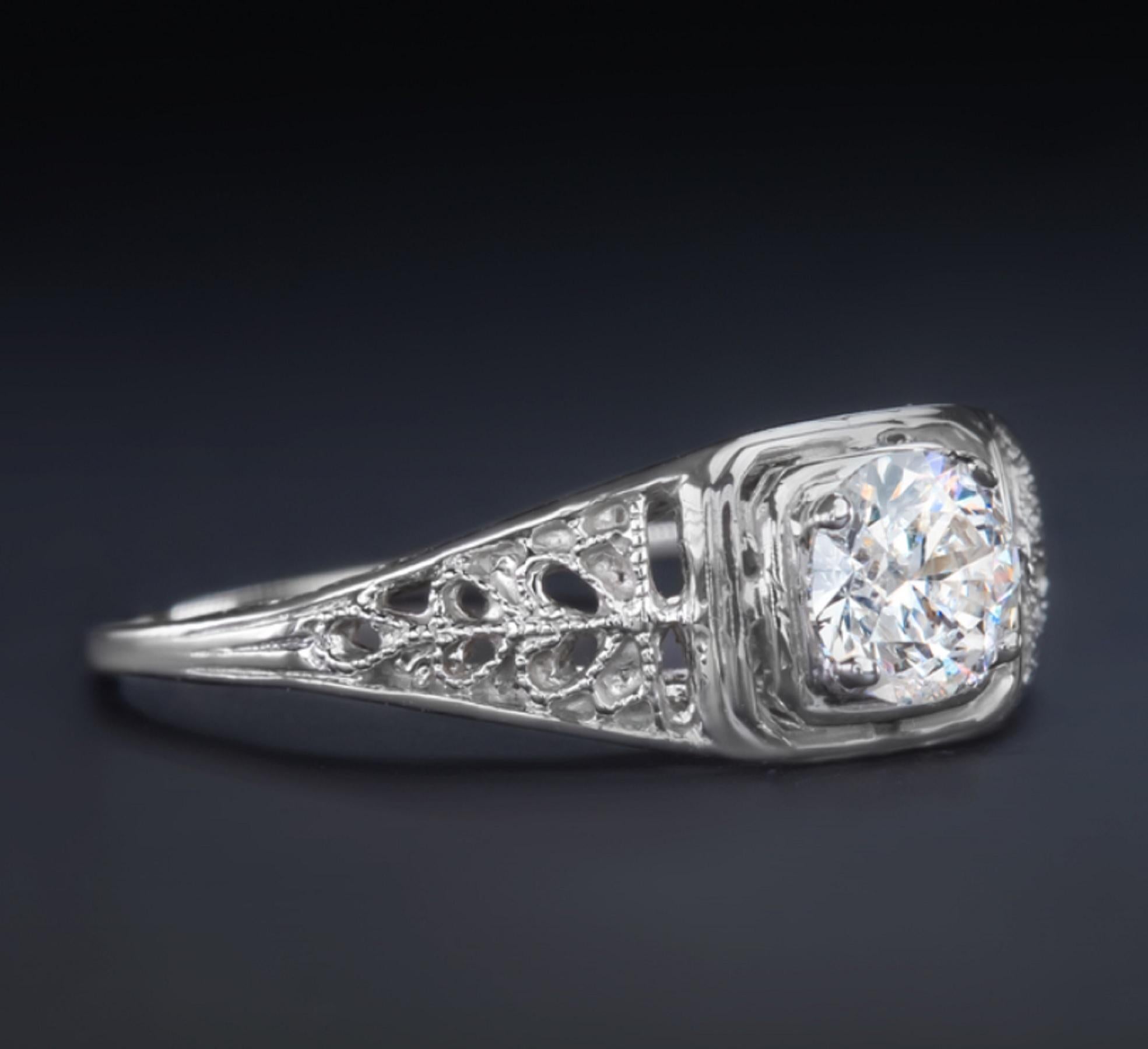 This gorgeous handmade engagement ring features a vibrant 0.50 carat round brilliant cut diamond set in a classically elegant design.

The diamond is beautifully white, eye clean, and dazzlingly brilliant! It is perfectly complemented by the utterly