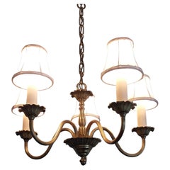 Exquisitely cast brass chandelier with a shade, 1950s, in the neoclassical style