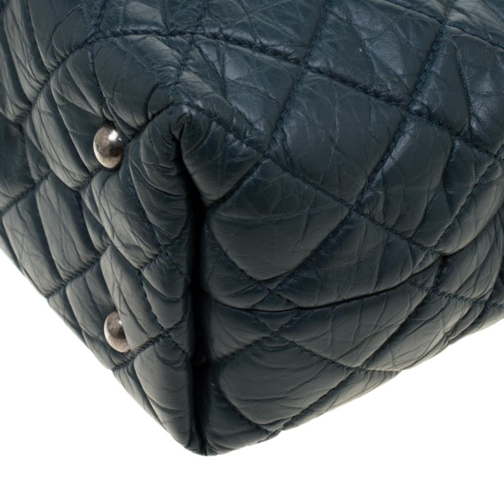 Exquisitely crafted from aged leather, this Reissue tote from Chanel bears their 4