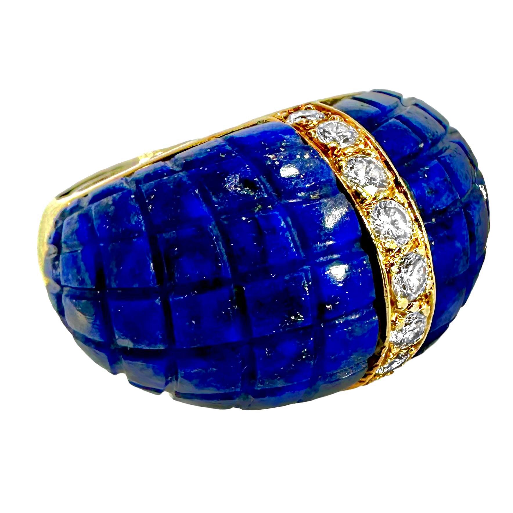 This very stylish 18k yellow gold, Lapis-Lazuli and diamond vintage Italian creation is comprised of a center line of nine round brilliant cut diamonds, flanked on both sides by large bombe panels of rich blue Lapis-Lazuli with flecks of white and