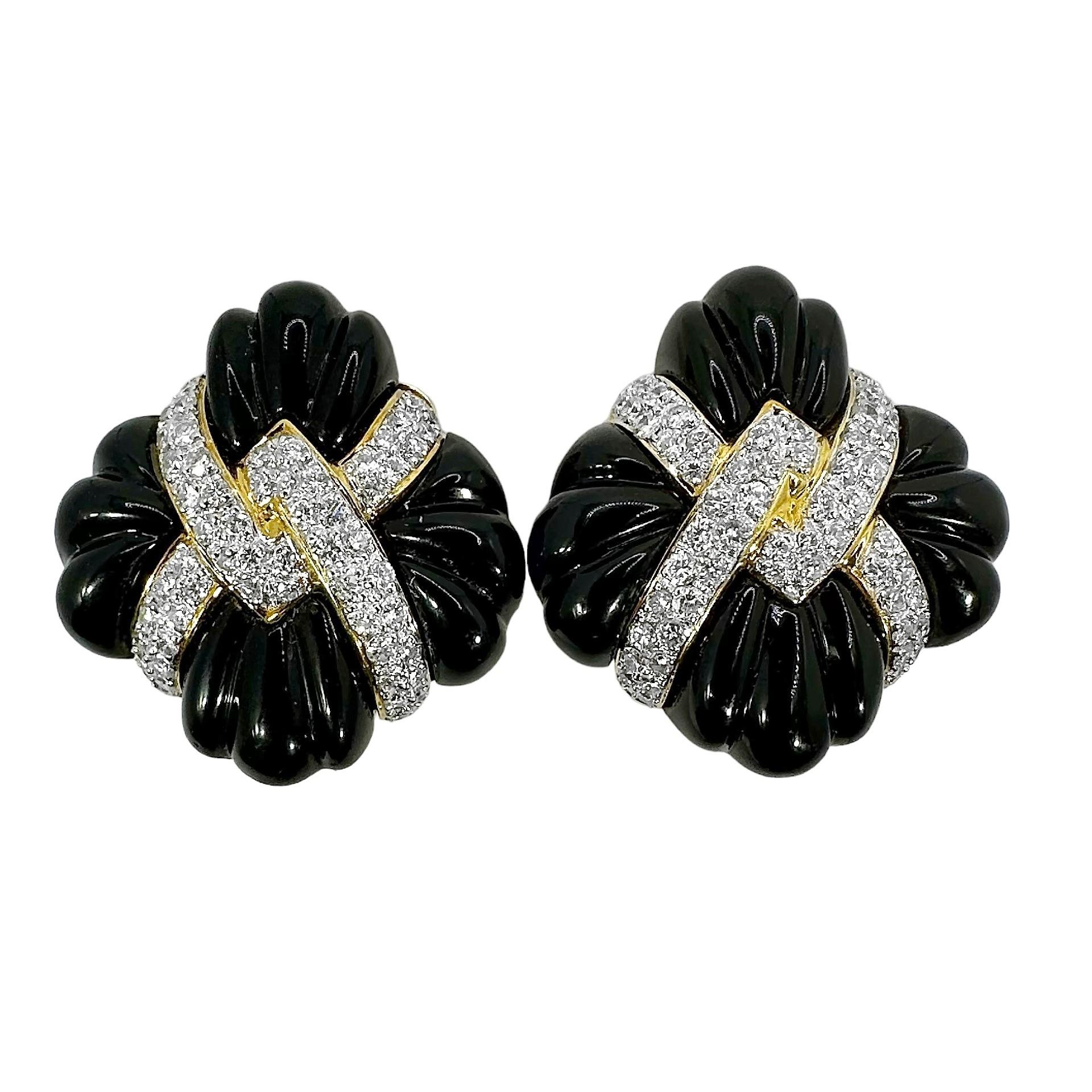 18k yellow gold frames with very high quality clip backs support hand cut, fluted black onyx which is crisscrossed with intertwined gold and diamond ribbons. The effect is very dramatic. This wonderful pair of 1970's fashion earrings bear all the