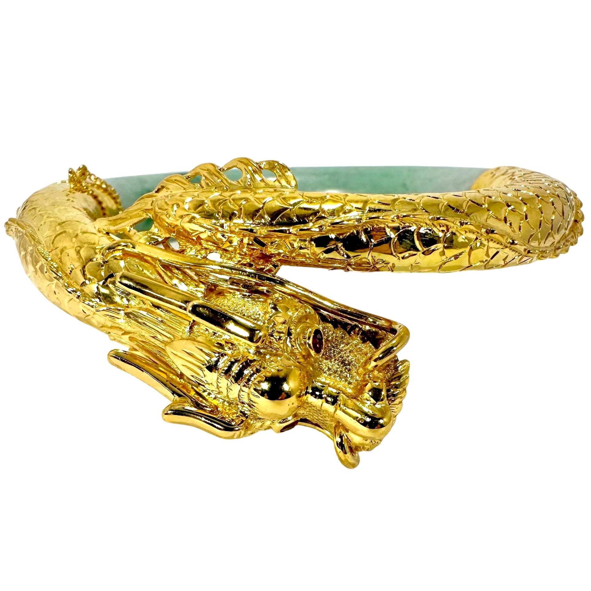 This strikingly beautiful and exquisitely hand crafted vintage bracelet features an intricately and expertly created dragon caricature, replete with ruby eyes. An incredible amount of attention has been paid in the execution of the dragon's head and