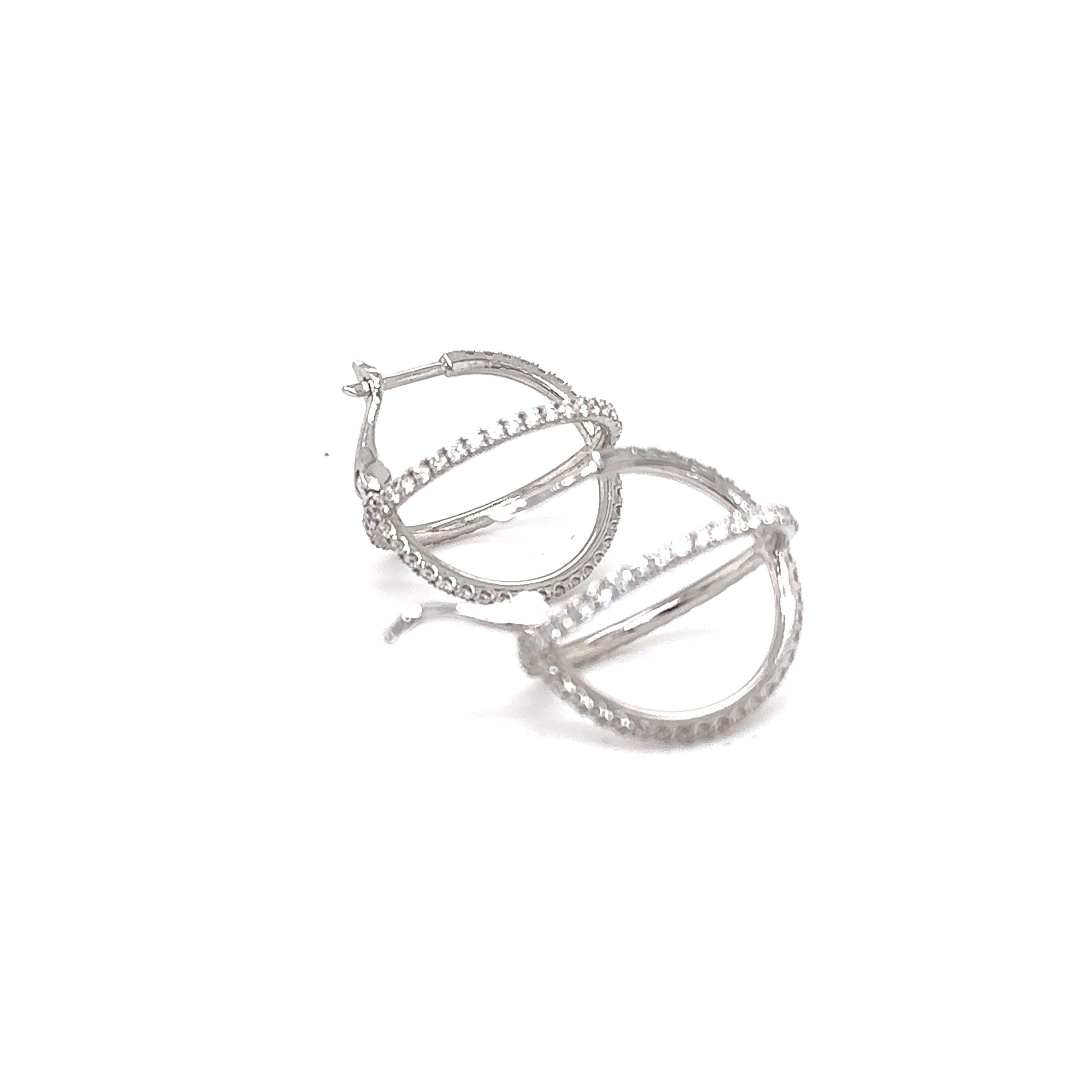 18K White Gold Round X Hoop Earrings

Metal: 18K White Gold
Diamond Info: G/H SI, 142 Diamonds 1.30 CWT.
Total Ct Weight: 1.30 CWT.
Item Weight: 4.88 gm
Measurements:  18.80 mm

