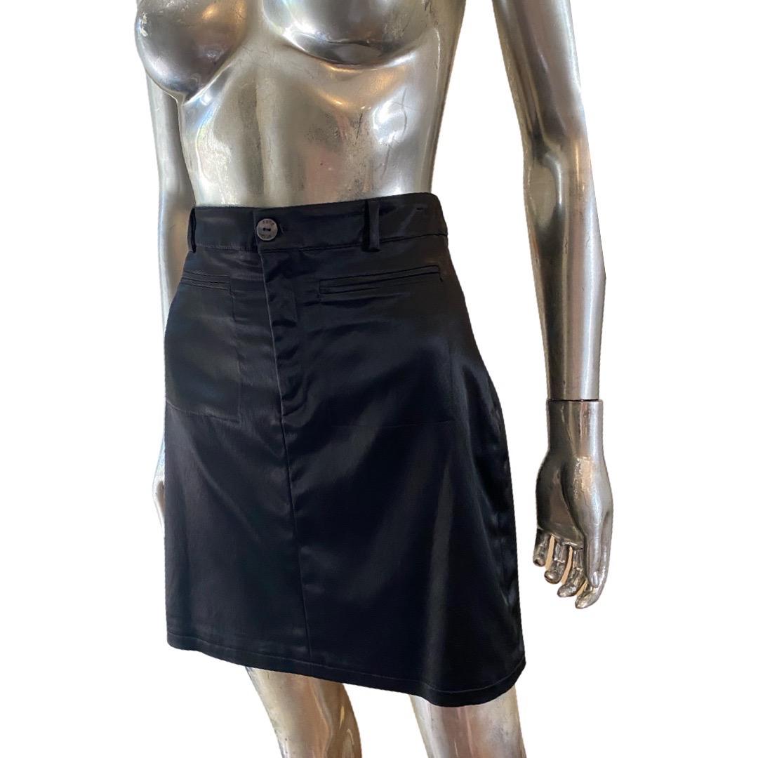 A vintage black satin skirt by Italian company Extē. This skirt comes from the more contemporary Extē Jeans division. Styled like a Jean with welt pockets and belt loops it is a modern, fun dress up or dress down piece. Made in Italy. Italian size: