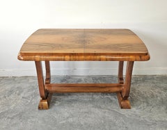 Extendable Art Deco dining table with harp-shade legs done in walnut root veneer