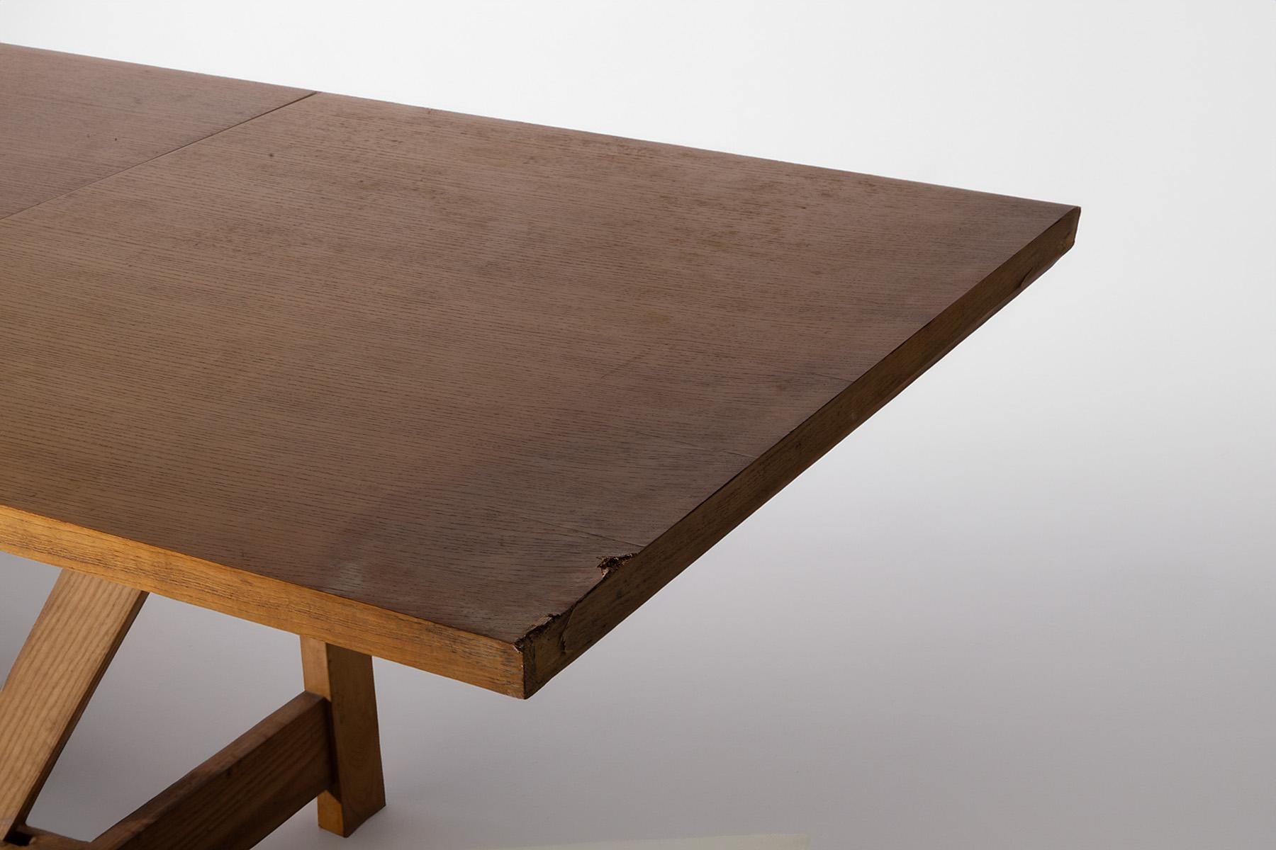 This wooden table is a true design gem, born from the creativity of designers Werther Toffoloni and Piero Palange for Germa in the 1970s. Characterized by sober and functional elegance, this piece of furniture stands out for its versatility and