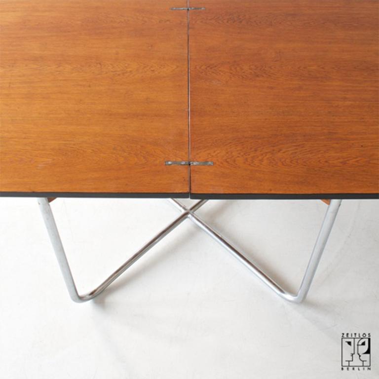 20th Century Extendable Bauhaus dining table made of tubular steel and veneered table tops For Sale
