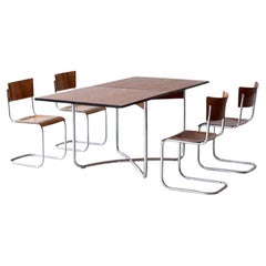 Extendable Bauhaus dining table made of tubular steel and veneered table tops