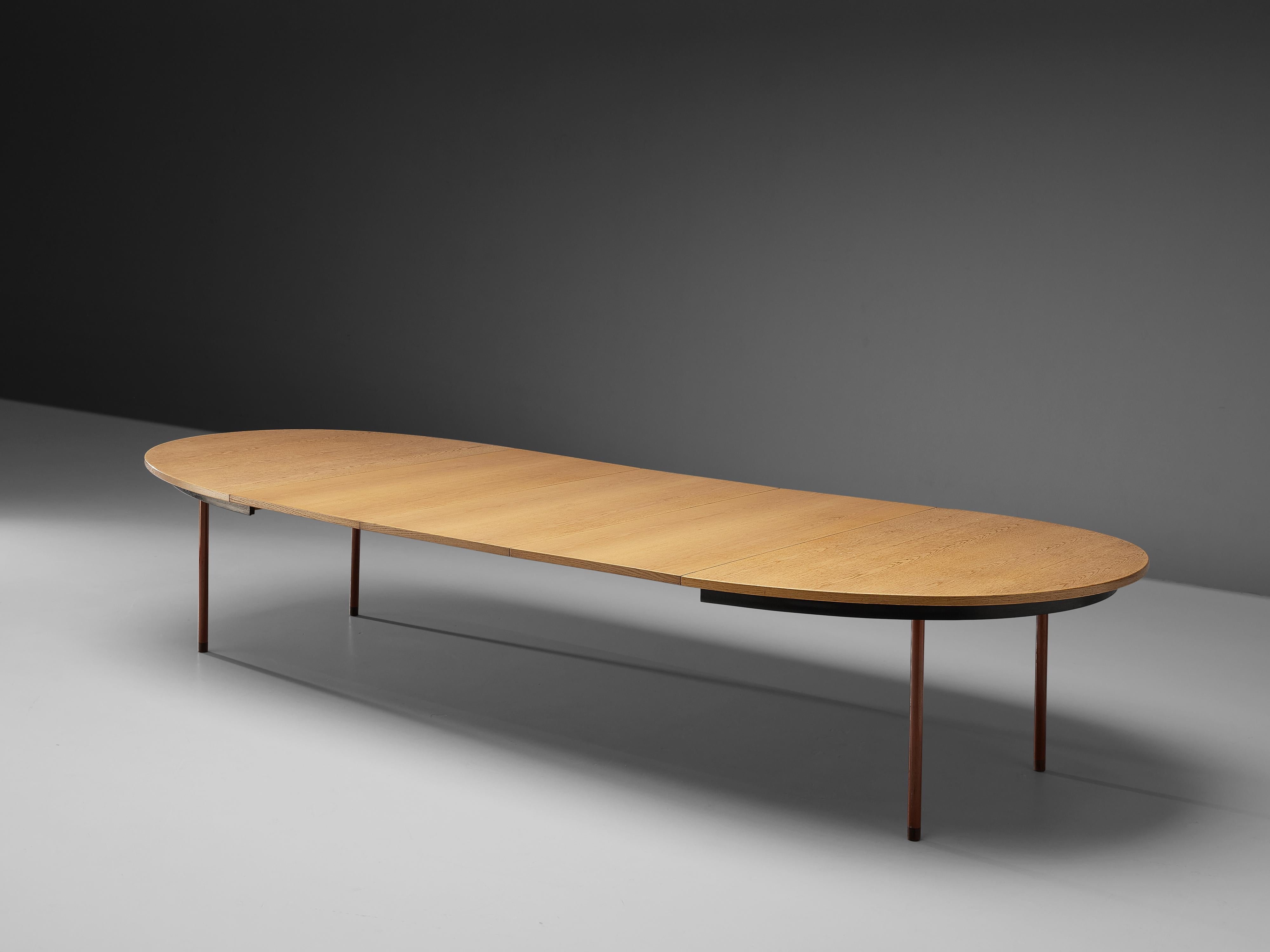Hans J. Wegner, extendable dining table, oak, red lacquered metal, Denmark, 1950s

This table by Hans Wegner is highly functional executed within a simple and streamlined layout. Three extra leaves transform this dining table into an extra large