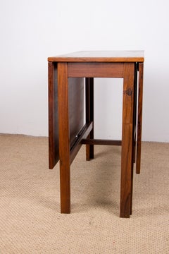 Extendable Danish folding table in rosewood, with 2 folding extensions, 1960.