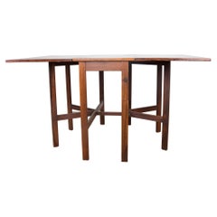 Table pliante danoise extensible en bois de rose, avec 2 rallonges rabattables, 1960.