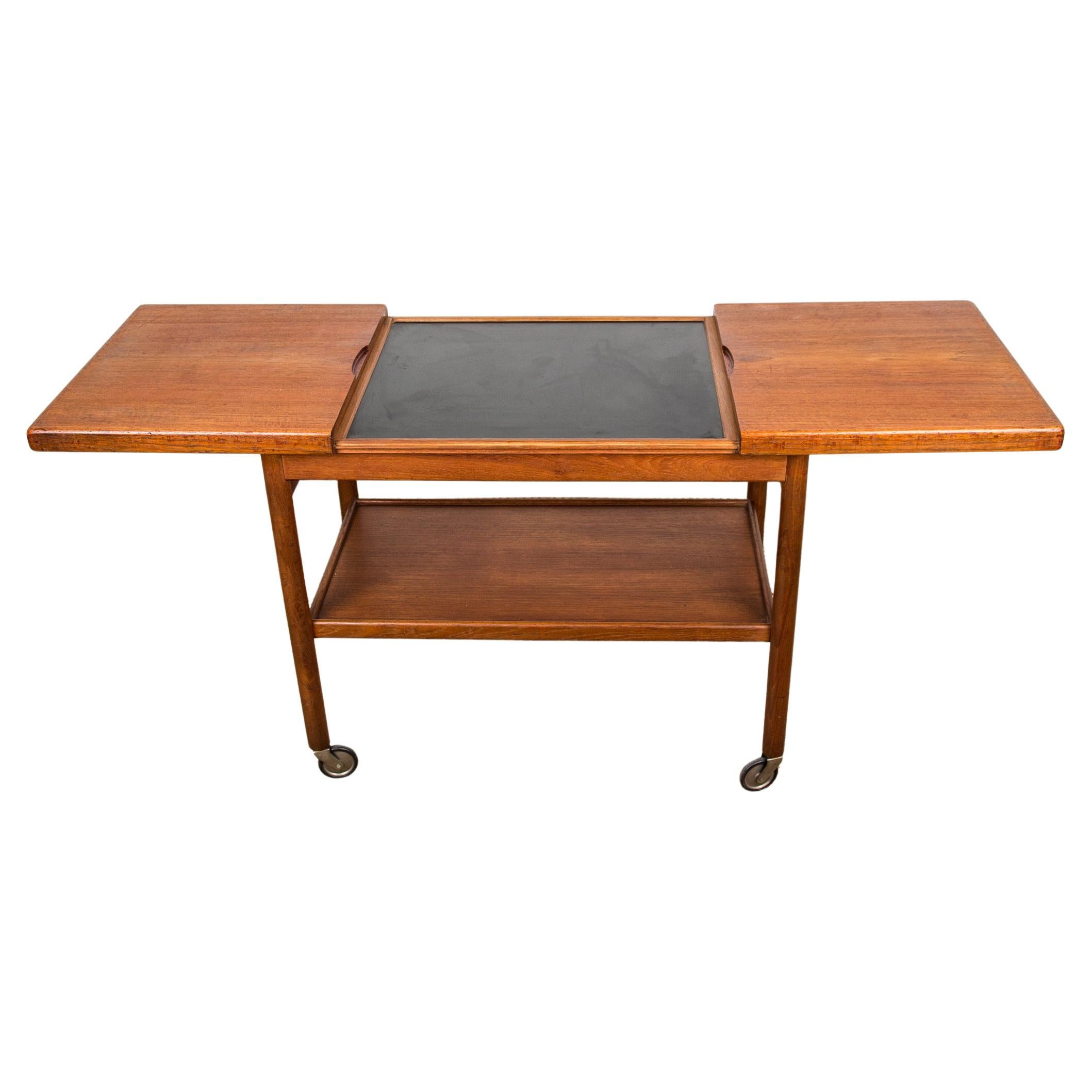 Extendable Danish rolling table with two levels, in teak, 1960 by Kurt Ostervig For Sale