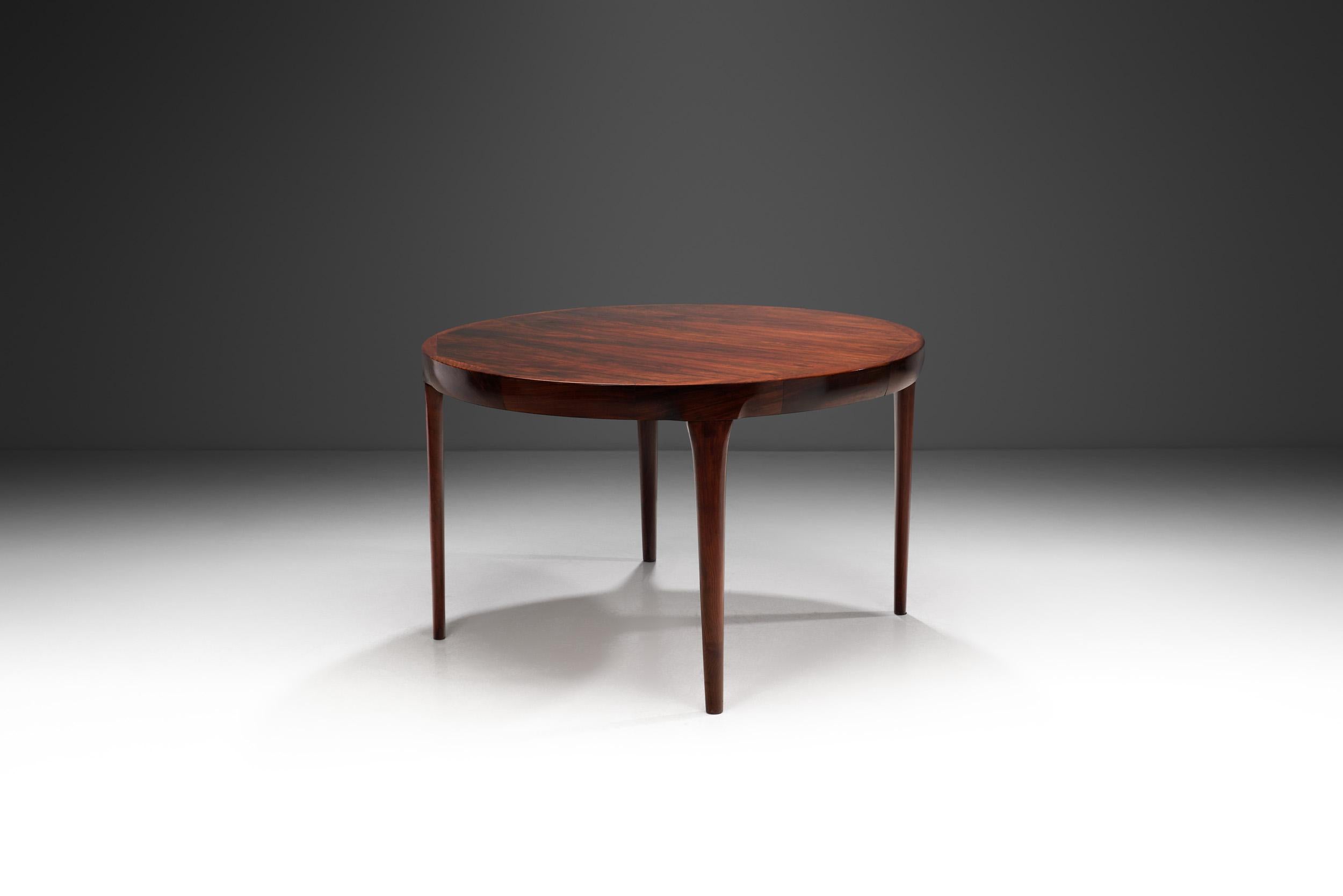 It was at Faarup Møbelfabrik where Danish designer, Ib Kofod-Larsen established himself as a renowned furniture designer. This beautiful, exotic wood dining table is a prime example why.

Many associate Danish furniture design with the country’s