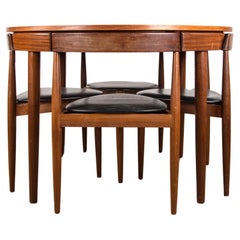 Extendable dining table and 4 Danish teak tripod chairs, Hans Olsen/Frem Rojle.