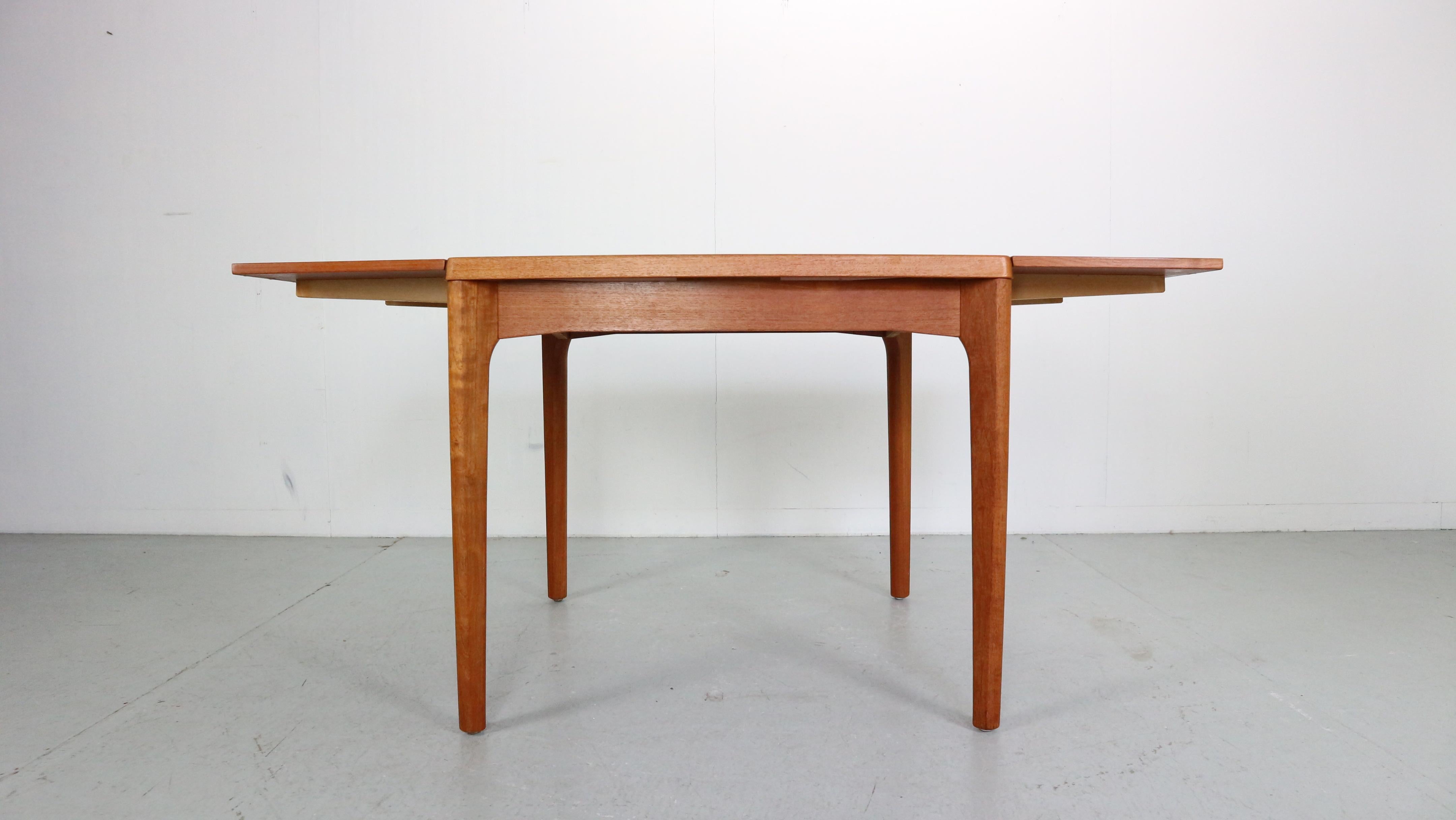 Mid-Century Modern Danish design dining table was designed by Henning Kjaernulf for Vejle Stole Møbelfabrik during the 1960s Denmark.
The table is extendable to 150cm wide, then not extended becomes square shape table to 84x 84cm wide top.
Teak