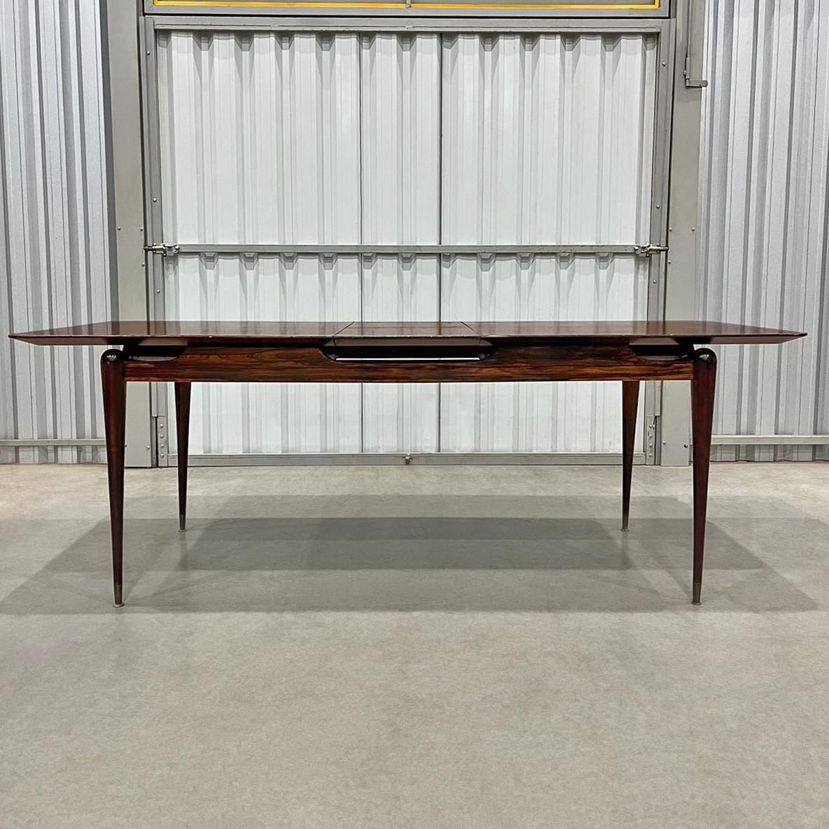 Available today in NYC with free shipping included, this Extendable Dining Table in Hardwood by Giuseppe Scapinelli, made in the 1950s in Brazil is nothing less than spectacular!

This extendable dining table in hardwood was designed by Giuseppe