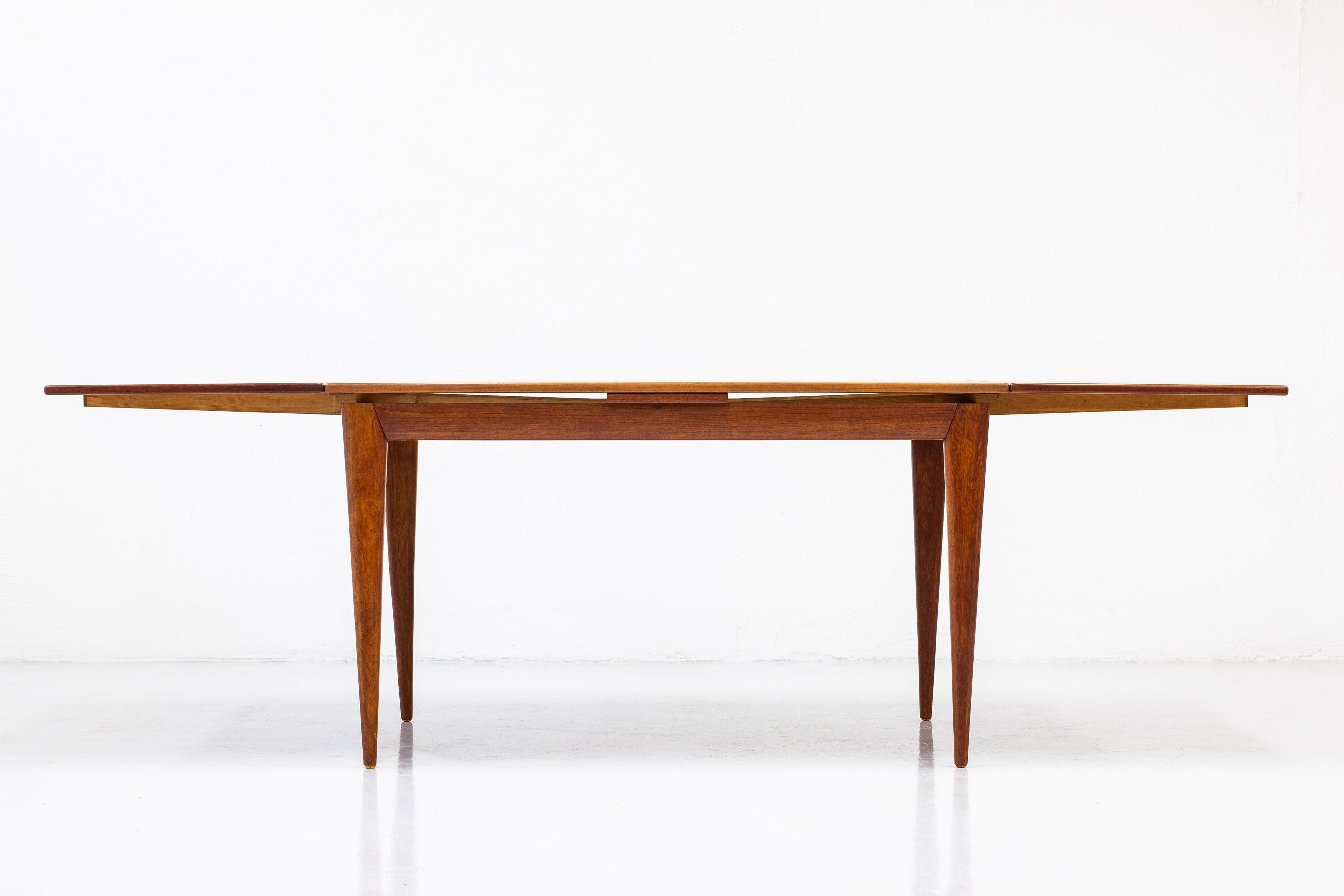 Dining table designed by Niels Møller. Produced in Denmark by J.L. Møller during the 1960s. Made from teak. 